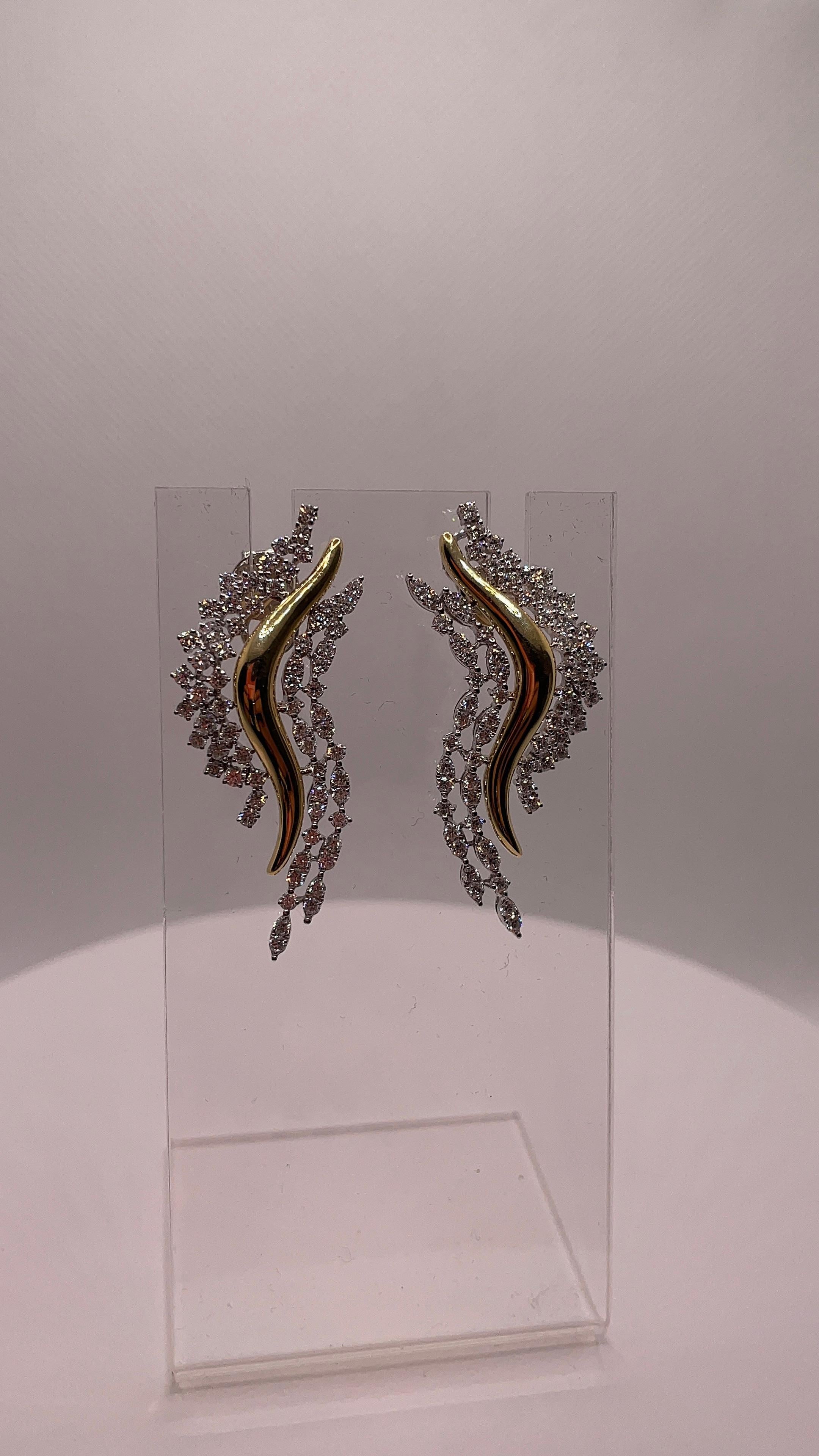 Celeste Flames are a celebration of movement and light, crafted in glowing 18K yellow gold and adorned with 130 brilliant-cut SI-graded diamonds. The flame-inspired curves capture the essence of elegance in motion, with each diamond placed to