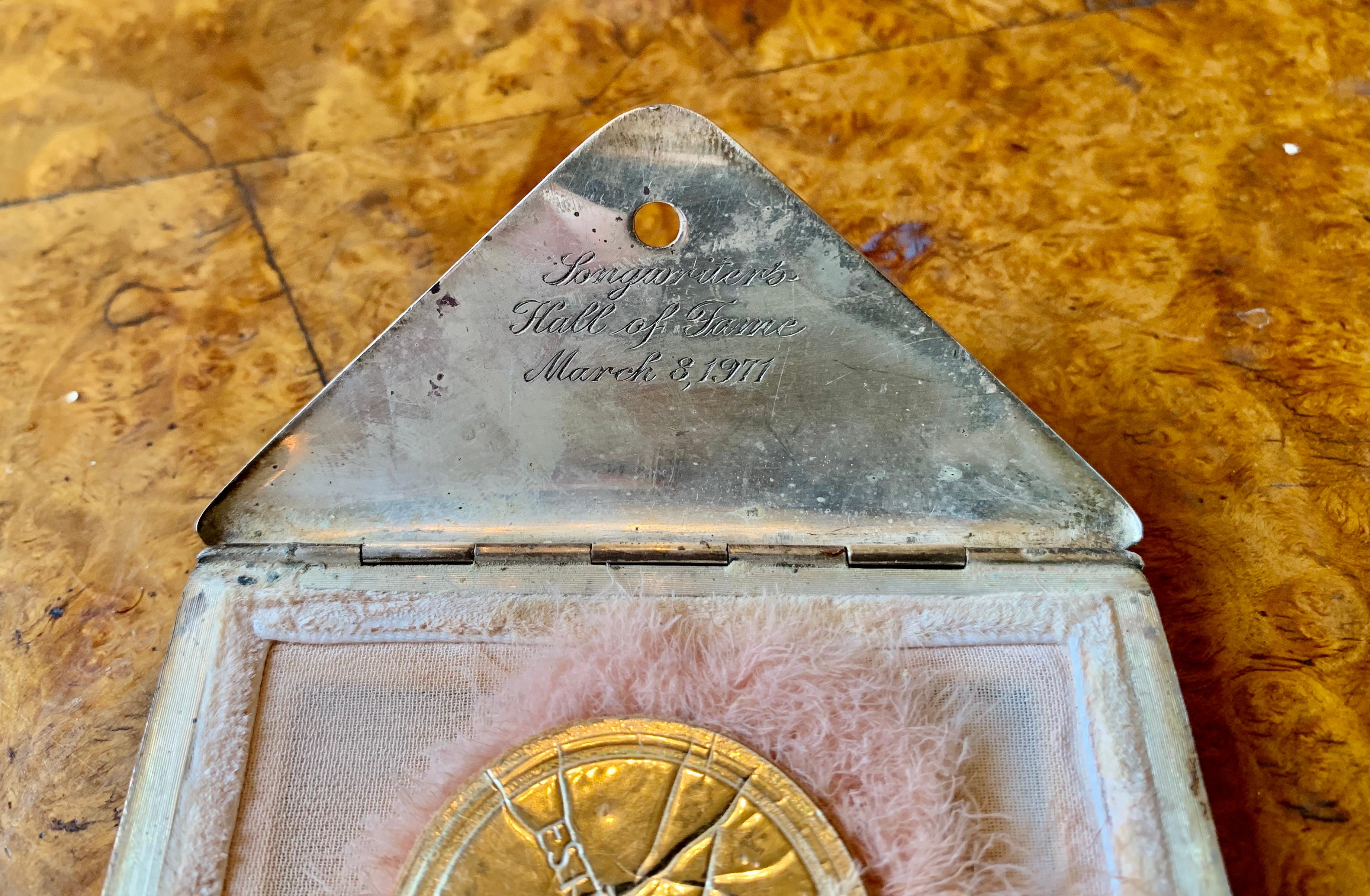 We are thrilled to offer the Tiffany & Co. Silver Envelope Compact belonging to legendary Oscar Winning actress CELESTE HOLM which was given to her and inscribed by the Songwriter's Hall of Fame.
The stylized envelope is of brushed silver, opening