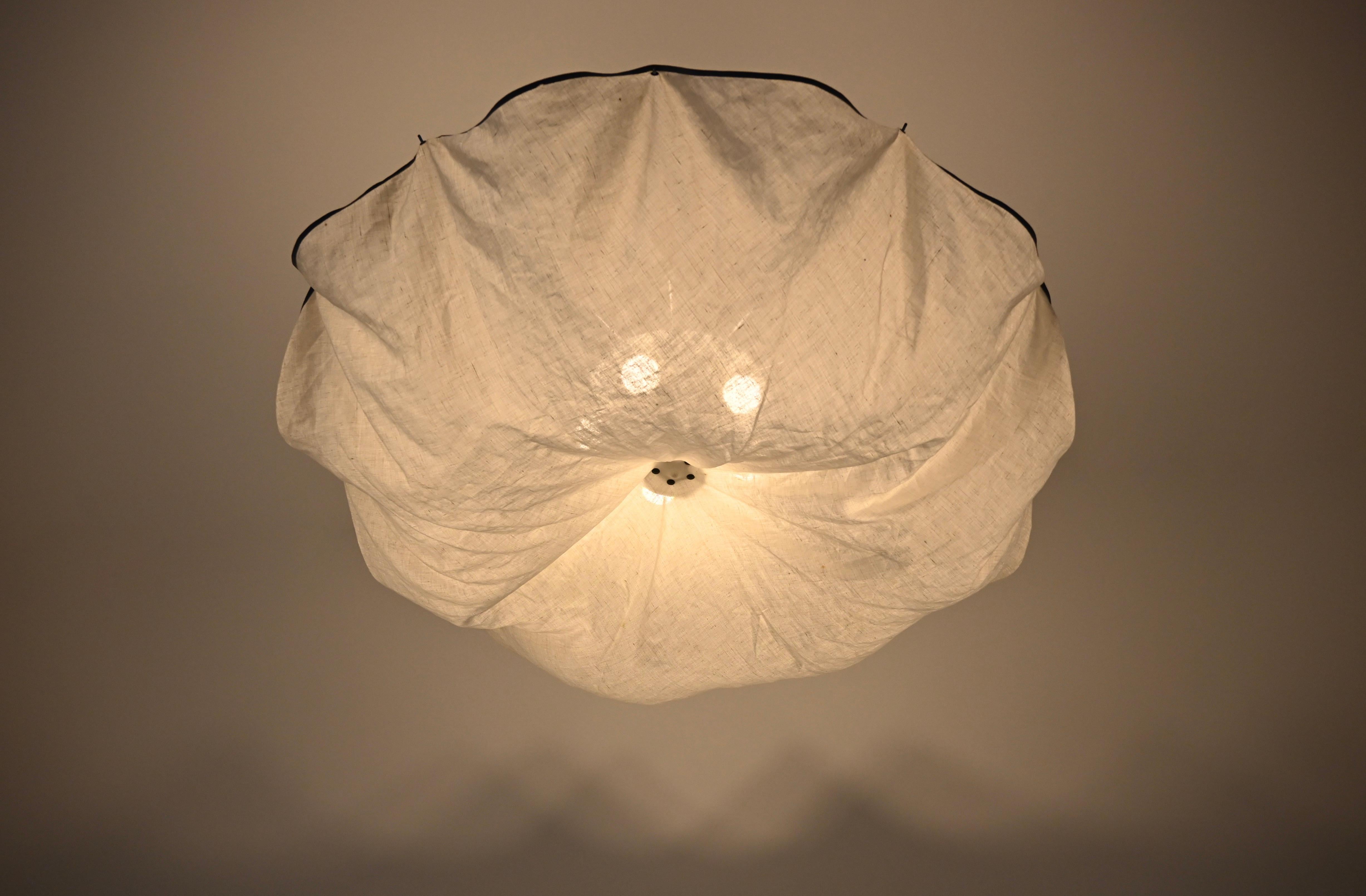 Ceiling light in white linen fabric and aluminum.  Model Celestia. Stamped Flos. Wear due to time and age. 
FOR SHIPPING, REQUEST US FOR RECEIVE THE BEST PRICE
