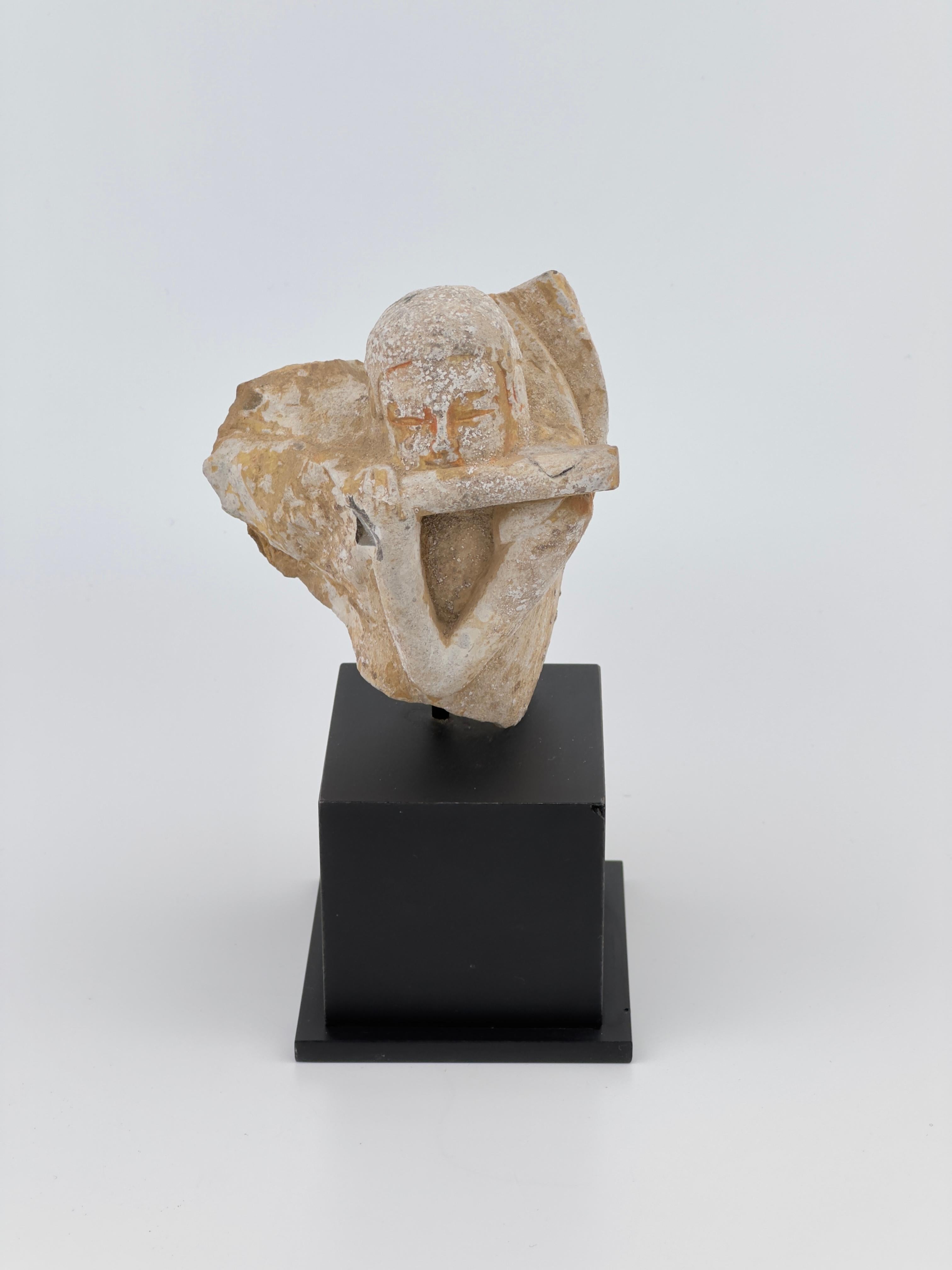 This statue appears to be a stone sculpture of an apsara, a celestial nymph from Buddhist and Hindu traditions. Despite its fragmentary state, the sculpture conveys grace and movement. The apsara is captured in a dynamic pose, perhaps once part of a