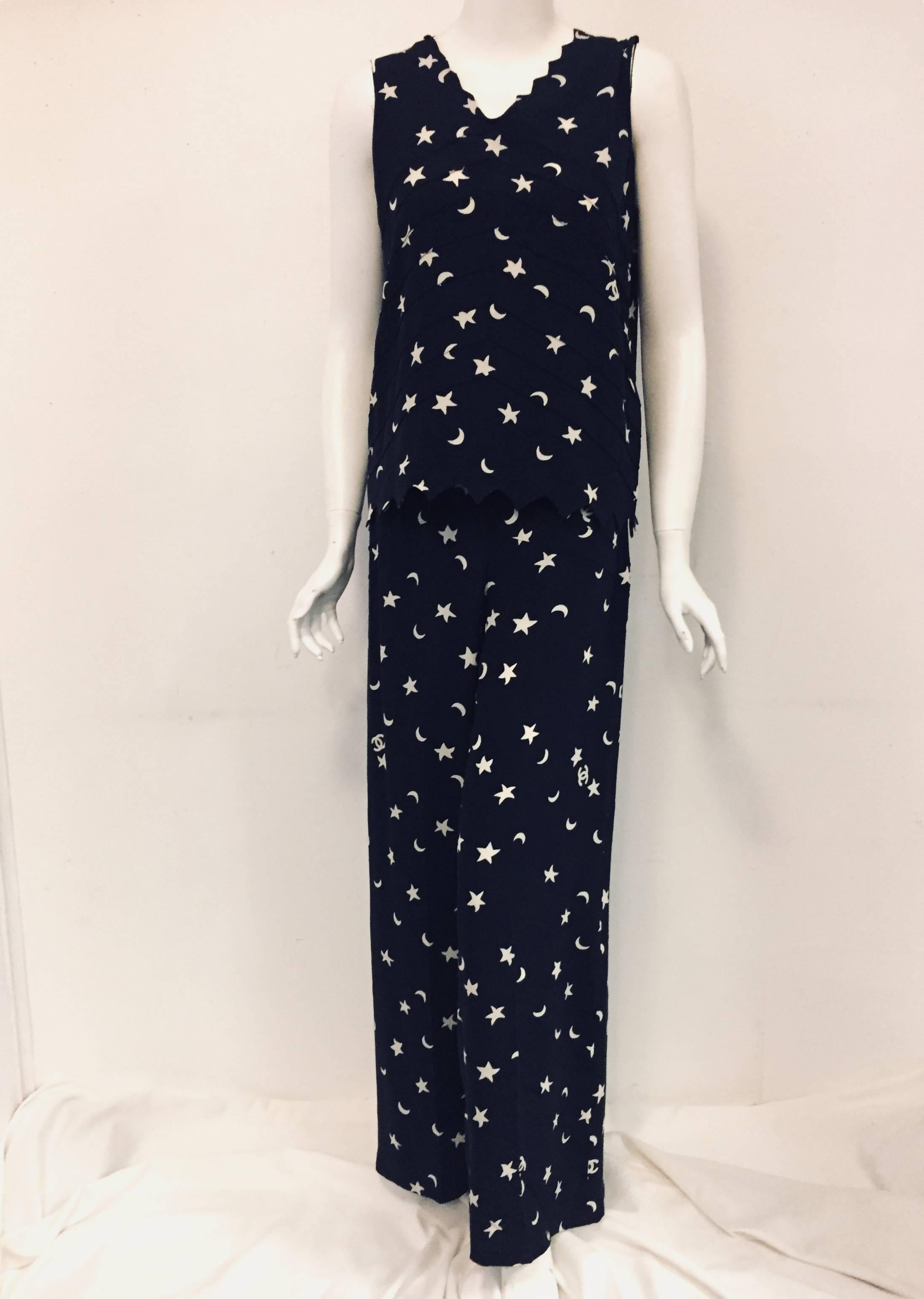 This is a four piece silk ensemble from Chanel 08P divine navy blue base with ivory stars and crescent moons  was created for the Chanel runway spring 2008 with the, out of this world, palazzo pants.  These mid waisted and shaped over the hips
