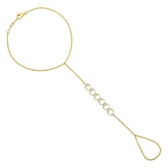 Chaîne à la main cercles célestes en or jaune 14 carats avec 19 diamants