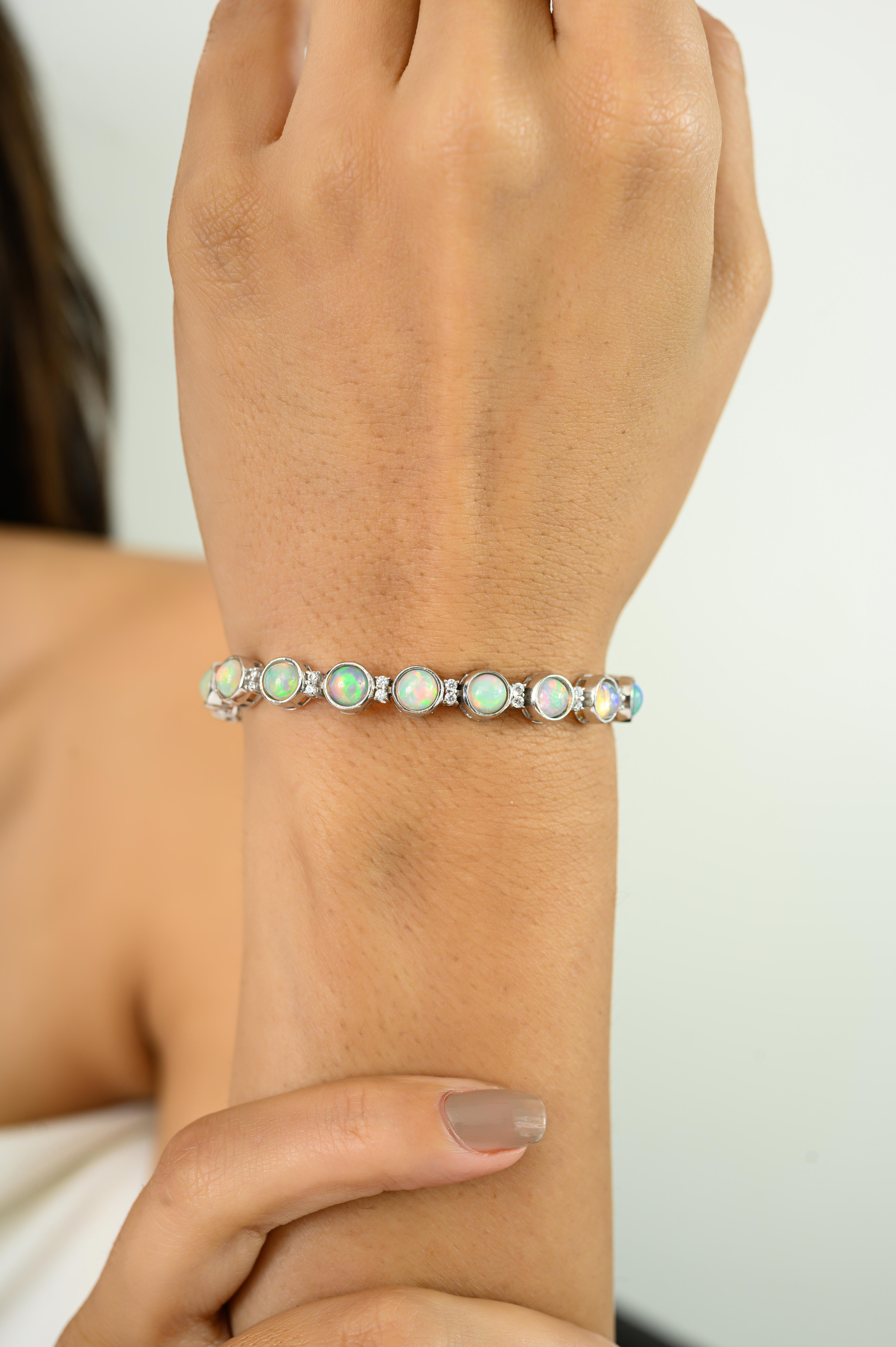 Dieses himmlische Feuer natürlichen äthiopischen Opal mit CZ Tennis-Armband in 925 Sterling Silber gefertigt. Mit seinen natürlichen Opalen, die in einem Kaleidoskop von Farben schimmern und mit funkelnden Diamanten besetzt sind, strahlt dieses