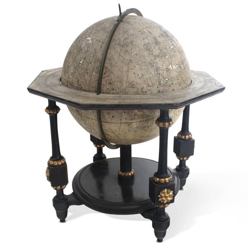 Globe with map of the stars and zodiac signs by Johann Georg Klinger, dated 1790. The globe has an octagonal horizon and a brass meridian and stands on a blackened foot with gilt details.