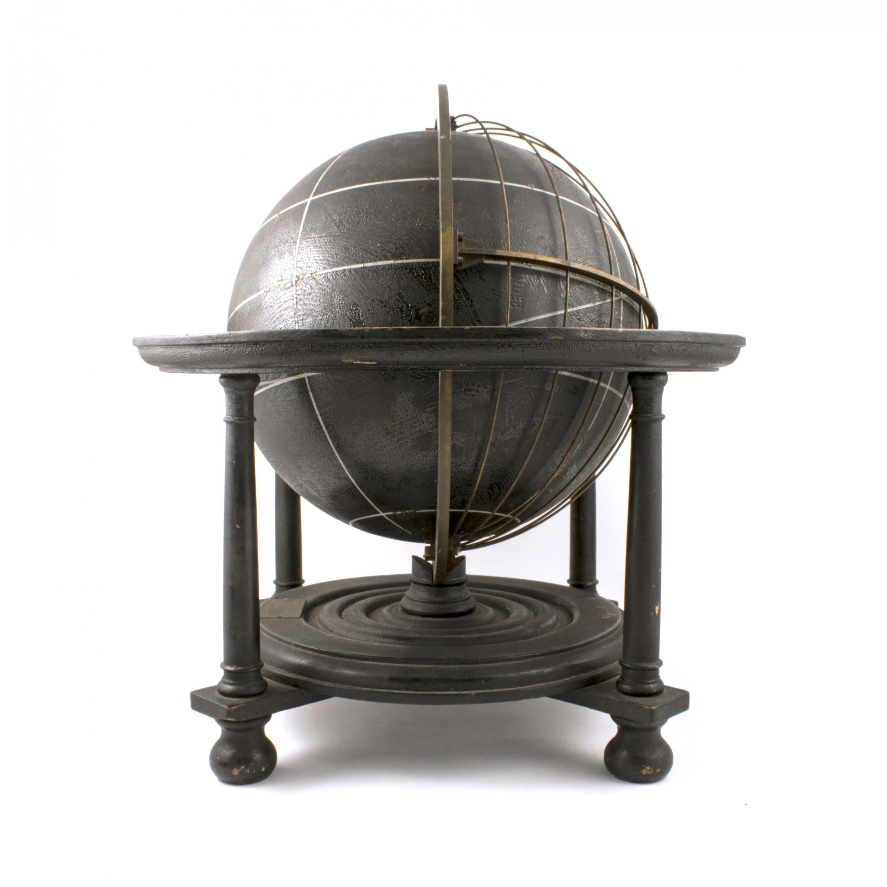 Black wooden celestial globe in original condition.
Blackened wood, horizon circle and brass rings with longitude measurements.
Mounted on wooden stand with turned legs and bun feet.
A very decorative globe with natural age-related