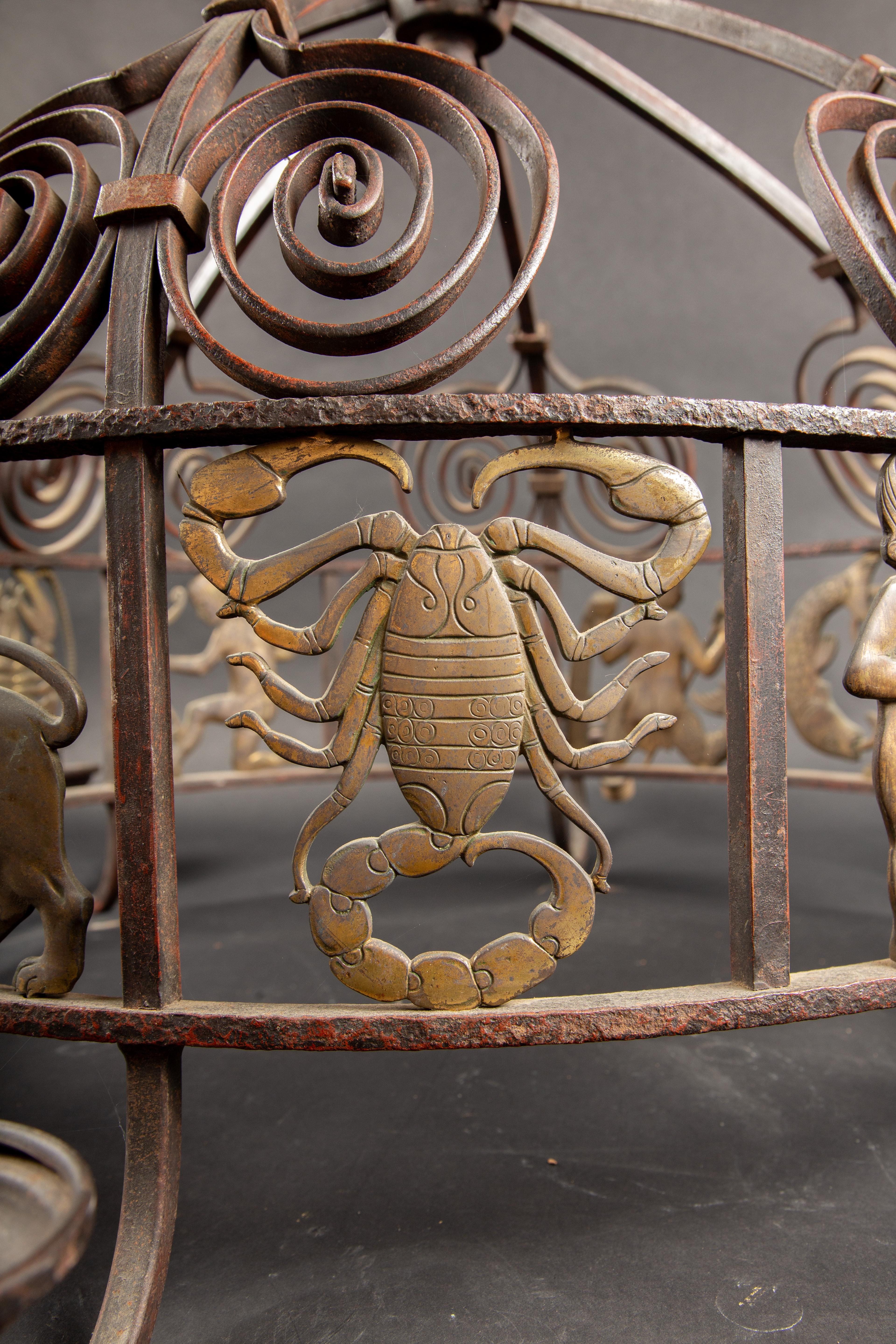Early 20th Century Celestial Splendor: 1920's French Art Deco Iron and Bronze Zodiac Chandelier For Sale