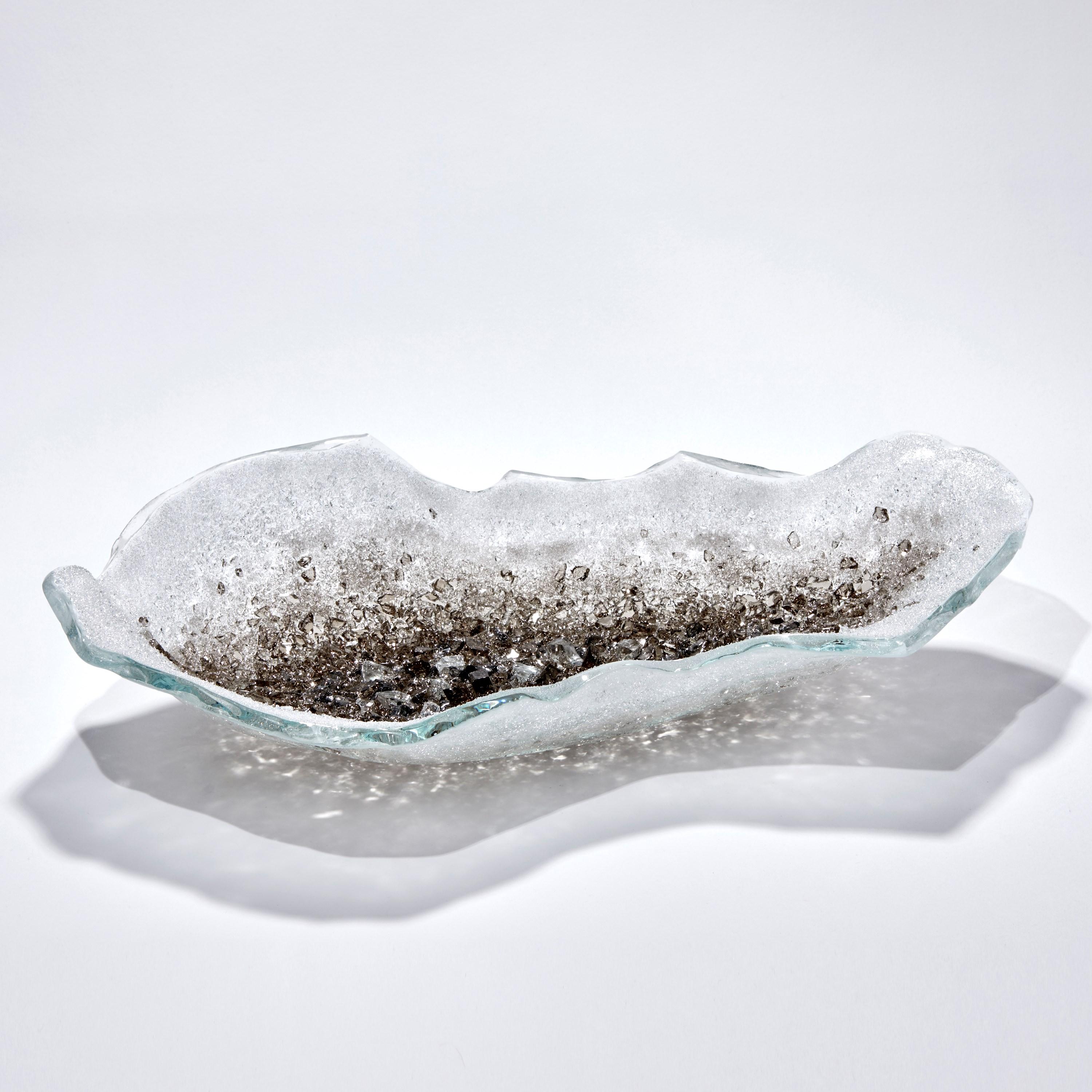 'Celestine VI' is a unique glass sculptural centrepiece by the British artist Wayne Charmer.

For Wayne Charmer, the fascination of glass is to exploit its translucent and reflective qualities. Inspired by nature, his signature techniques for his