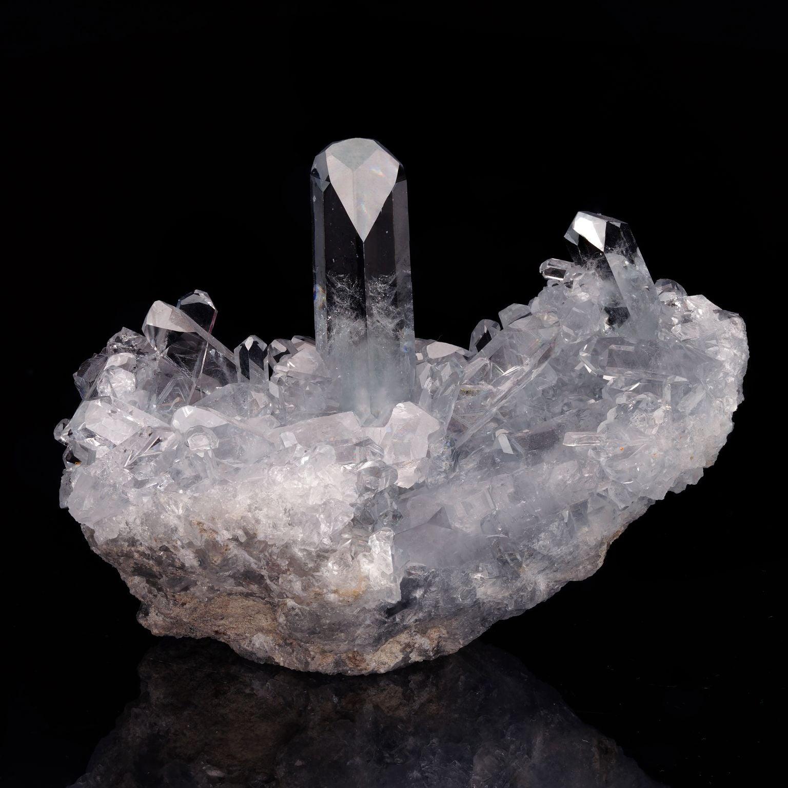 This striking, delicately blue-hued celestite specimen features a bed of incredibly lustrous and clear perfect terminations with several startlingly translucent points rising skyward, including one hefty, almost perfectly centered point offering