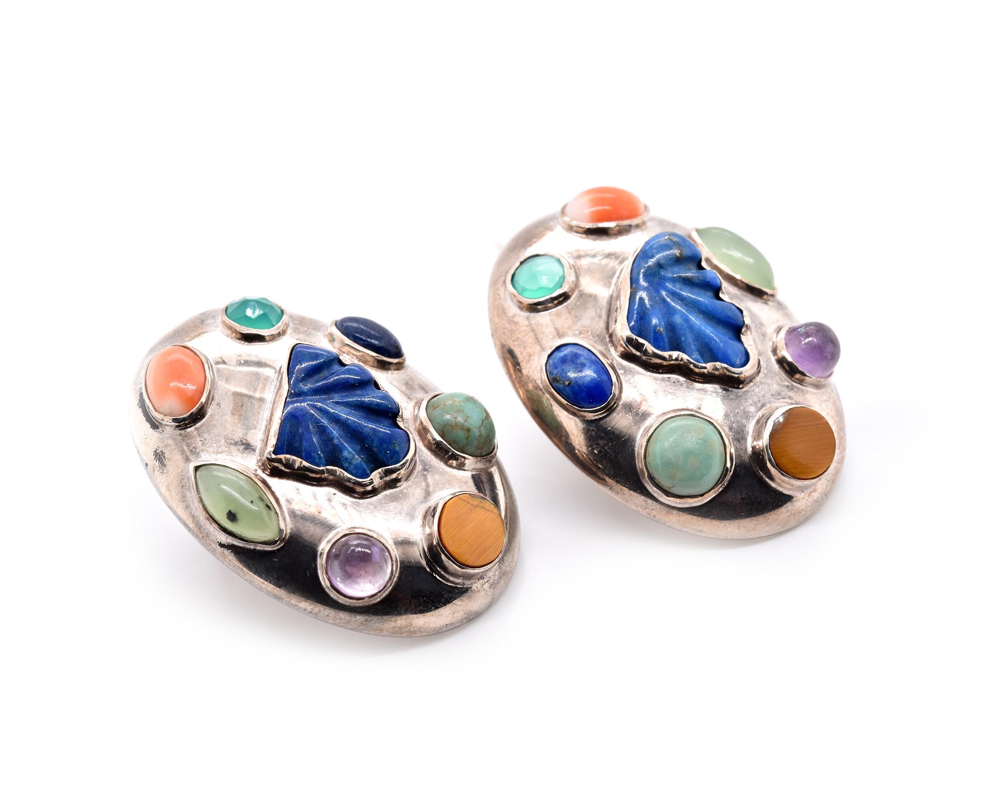Designer: Celia Harms
Material: sterling silver
Gemstones: lapis lazuli, tiger’s eye, amethyst, jade, coral, green chrysocolla, and turquoise  
Dimensions: earrings measure 34.15mm x 24.55mm
Fastening: clip-on 
Weight: 21.8 grams
