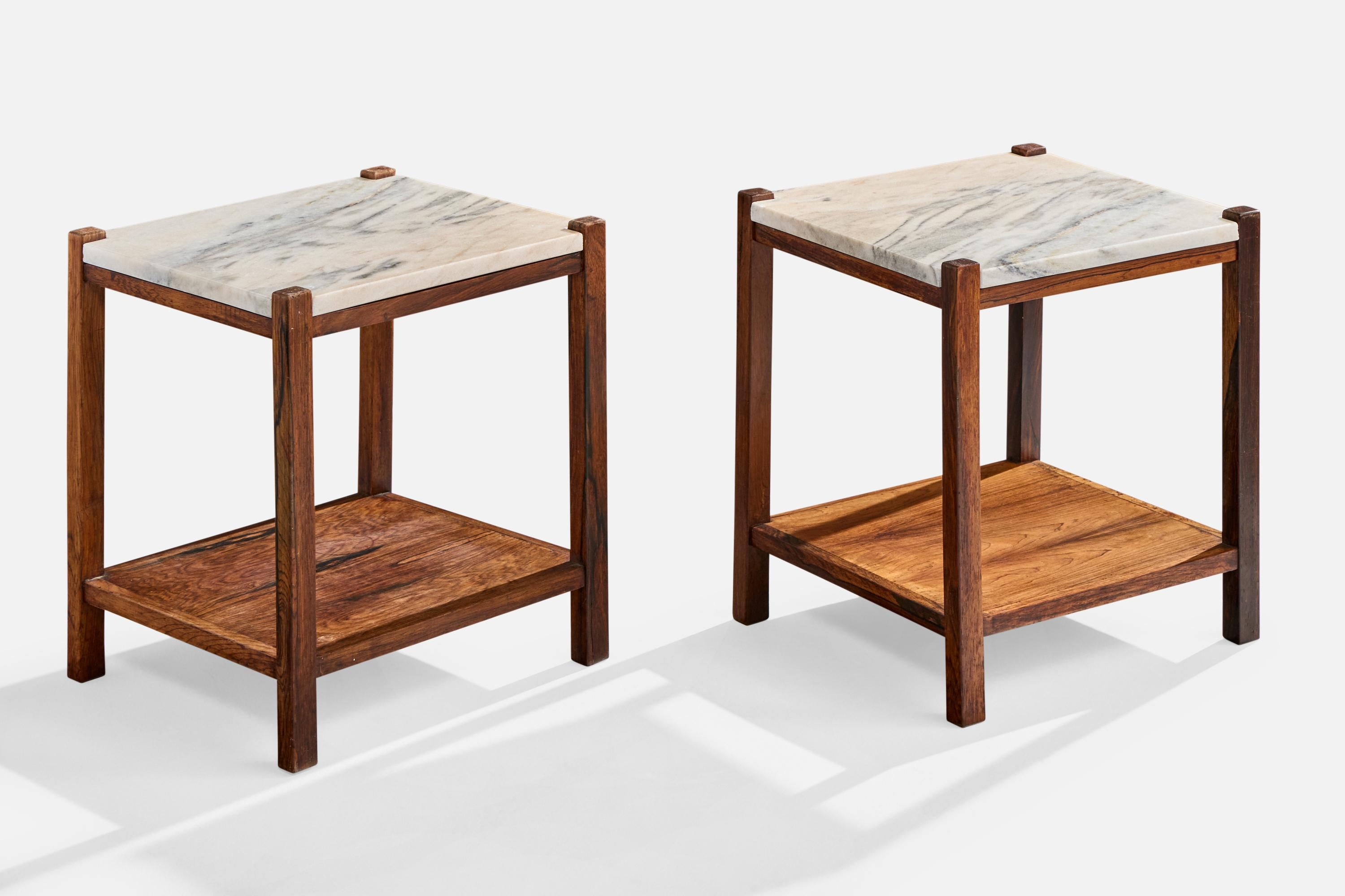 A pair of wood and marble side tables produced by Celina Decorações, Rio de Janeiro, Brazil, c. 1960s.

Cup stain on bottom shelf of one table, two scratches on one marble tabletop.

Dimensions: 17.75” H x 15.9” W x 13.9” D