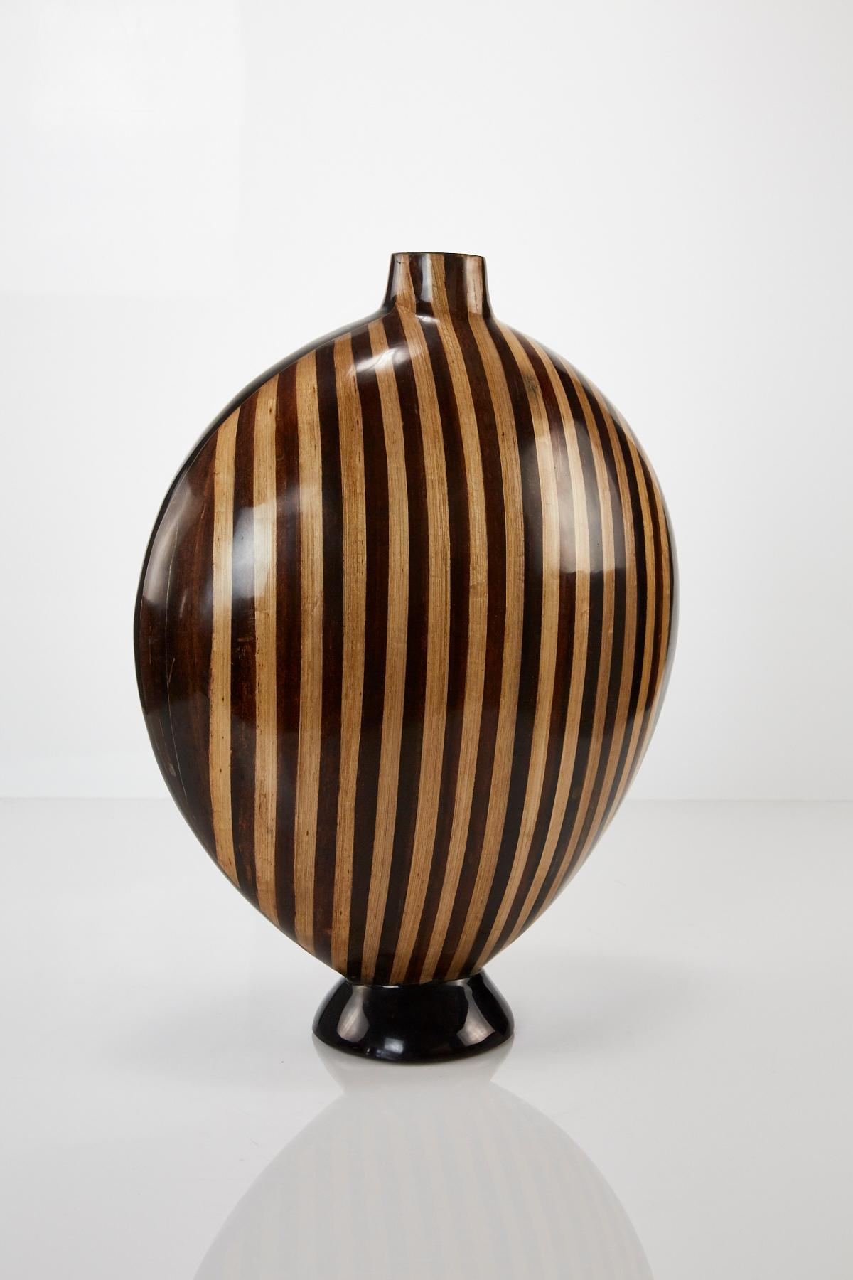 Large rounded shaped vase with black finish and decorative dark and light banana bark inlay. Asian styling.

All furnishings are made from 100% natural materials, carefully hand cut and crafted piece-by-piece and precisely inlaid to the form of the