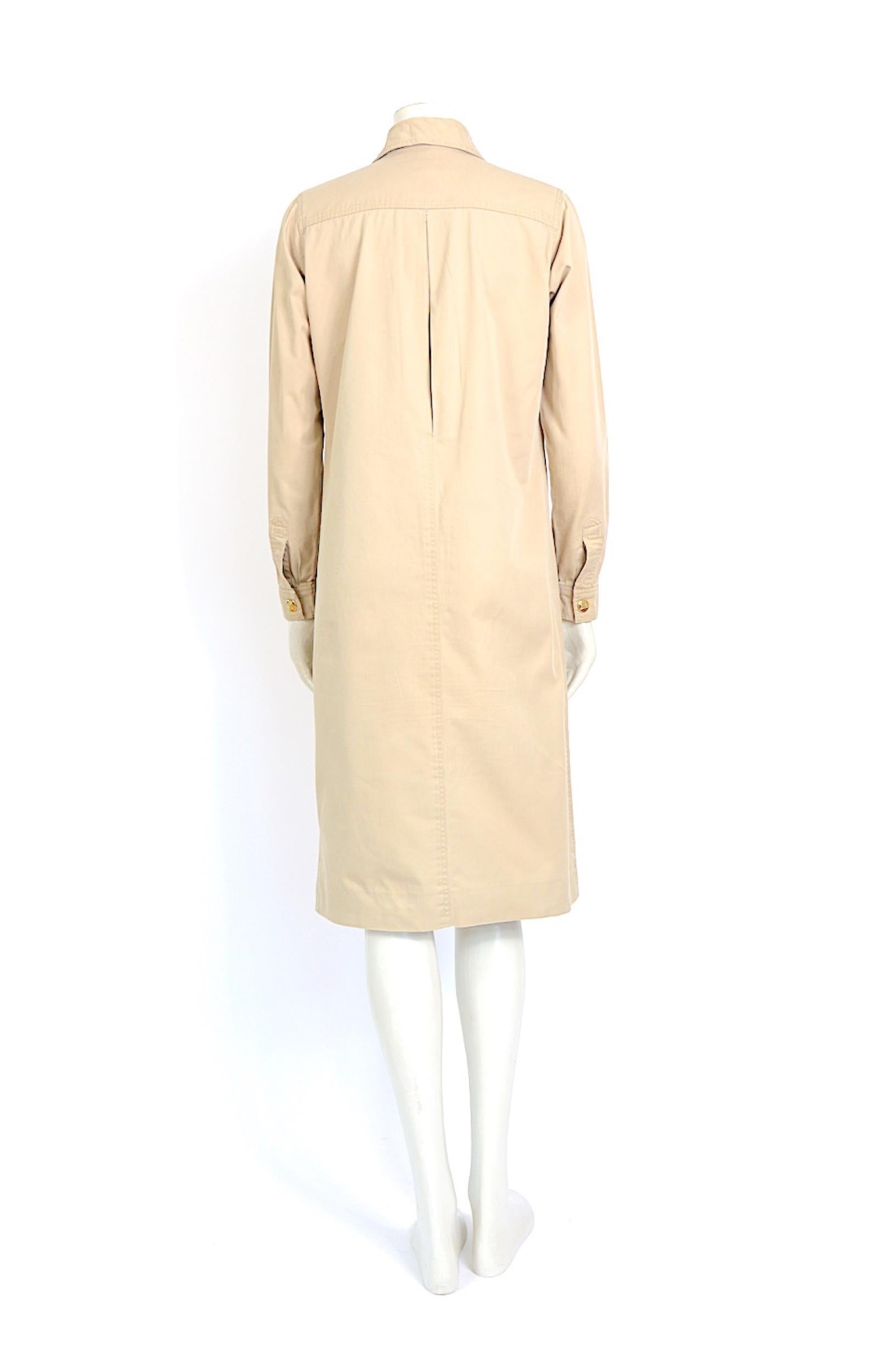 White Celine 1970s vintage safari dress with gold buttons and slide front pockets