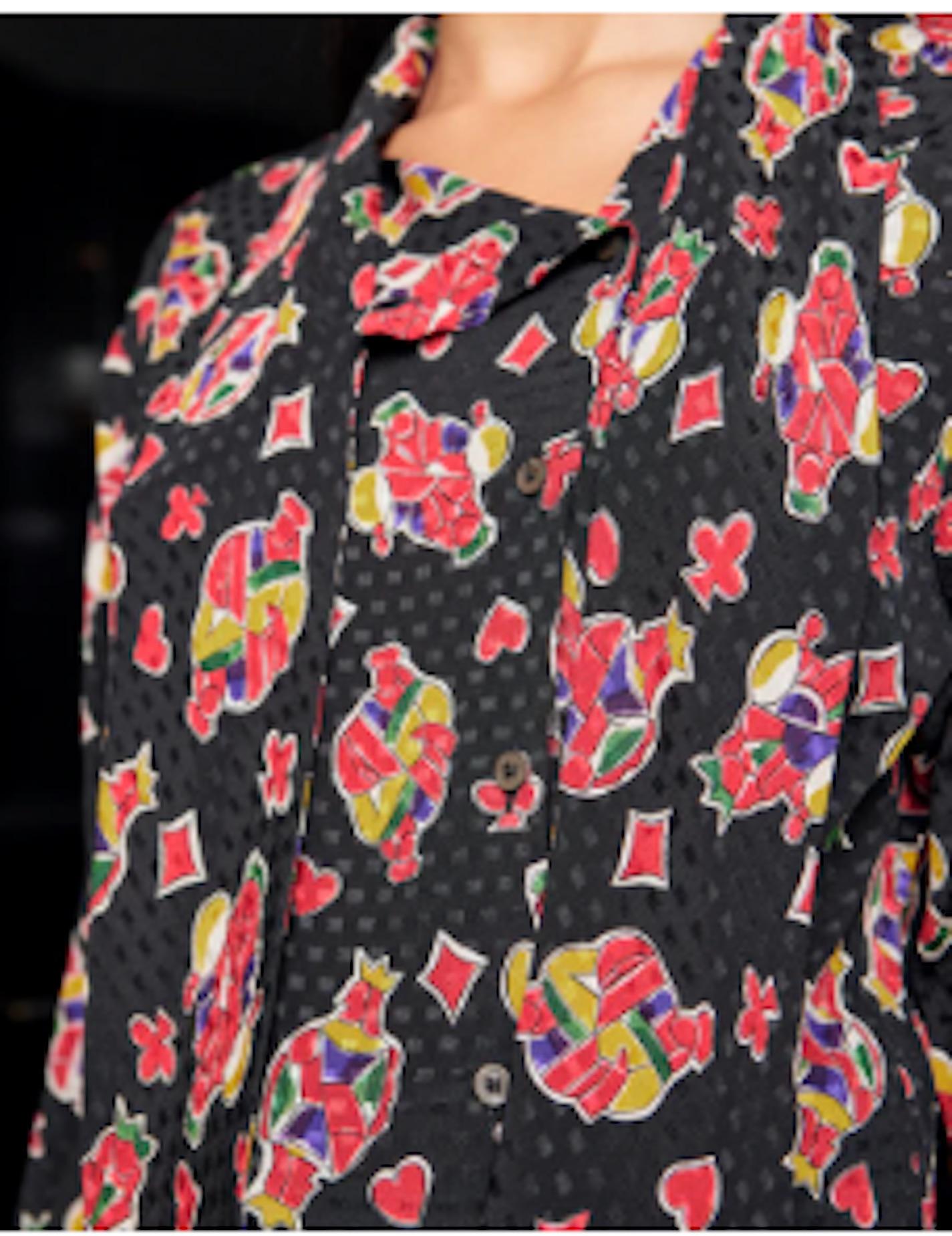 VINTAGE GRACE NY

1980s Celine silk button down blouse in multi-color print featuring hearts, spades, diamonds and clubs. Excellent Vintage Condition. 

Shoulders 16 in
Bust 38 in
Waist 32 in
Sleeve 23 in
Length 24 in

Can accommodate sizes