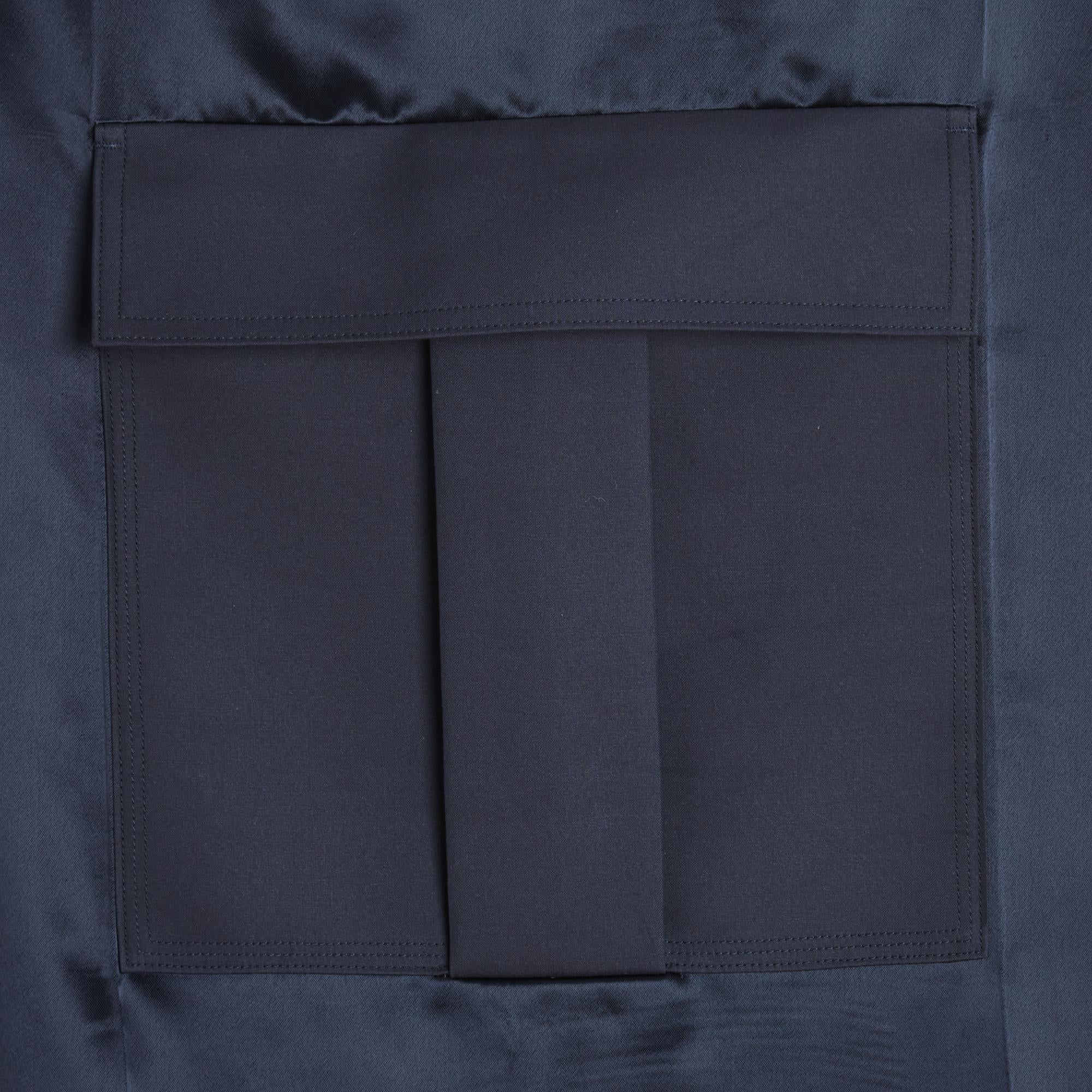 Céline skirt by Phoebe Philo (probably from her first Resort 2010 collection) in navy blue almost black satin viscose, slightly trapeze shape decorated with a pocket with box pleats and flap, lined with cotton and cashmere at the waist, closed with