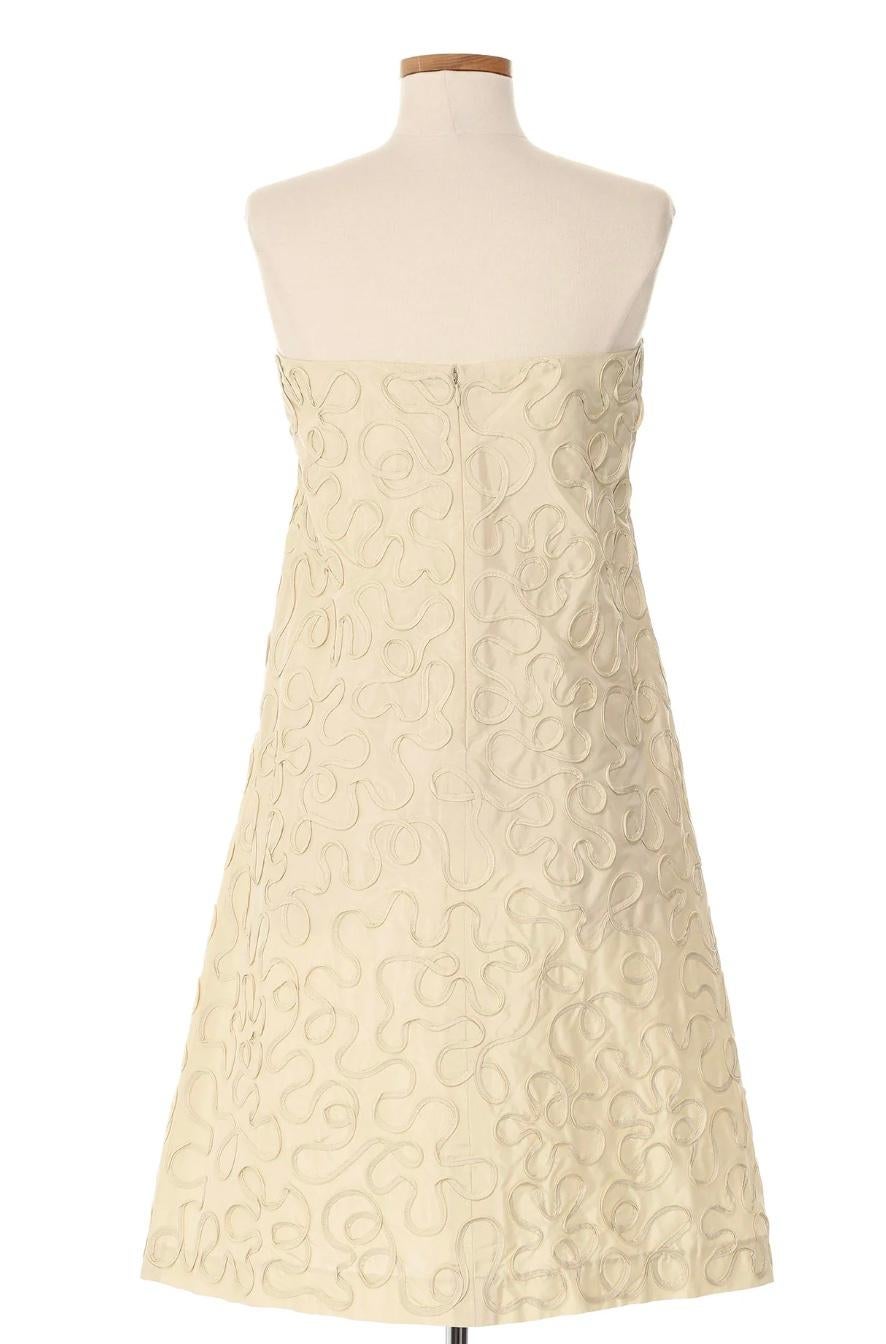 Celine 2010's White Strapless Dress with Ribbon Detail. This dress is a beautiful piece featuring a clean and minimalist design. The ribbon detail adds a touch of refinement and femininity to this timeless piece, making it a perfect choice for a
