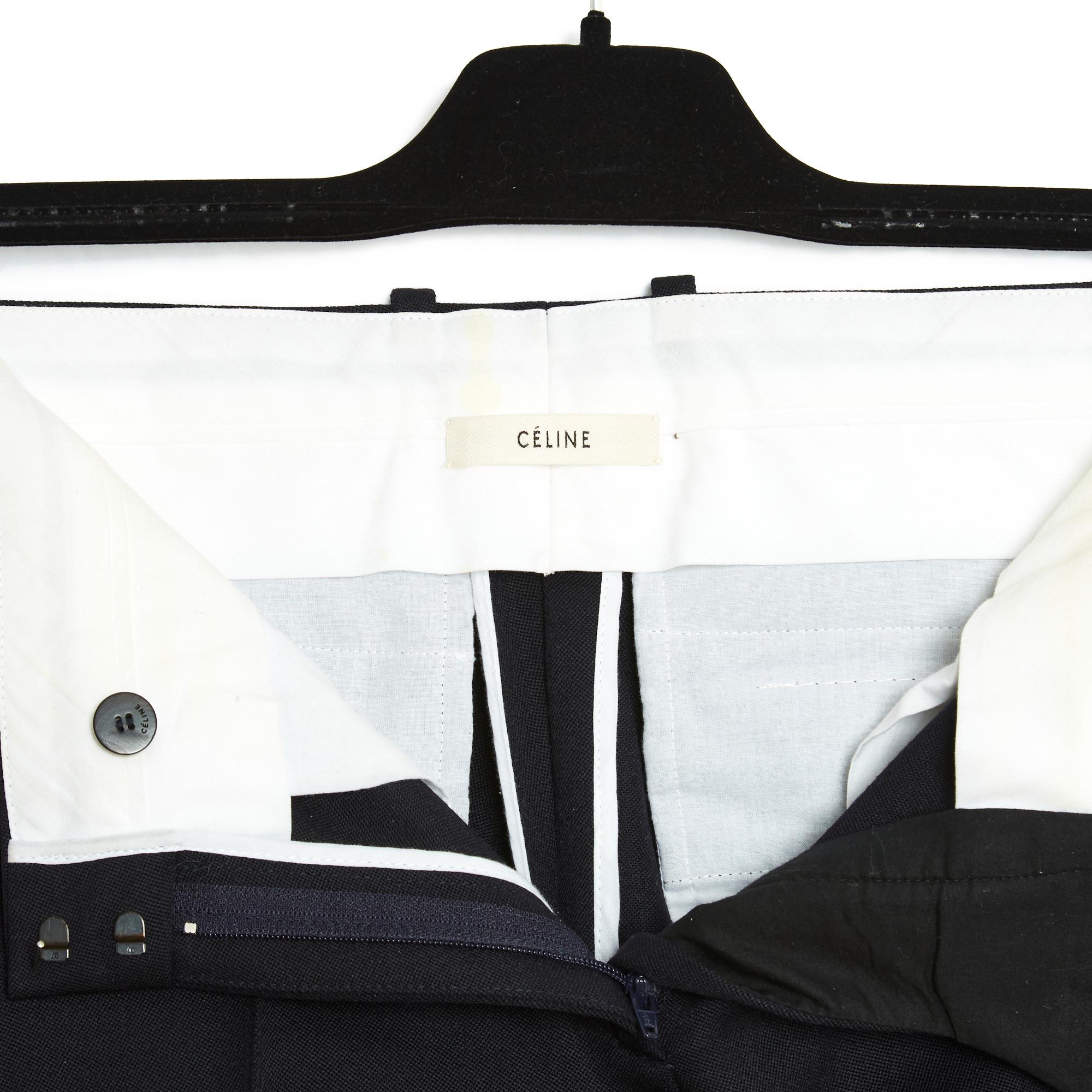 Céline pants by Phoebe Philo (circa 2014) in thick black wool cloth, Italian style (long the leg, without being tight, and slightly cropped) in a slightly lower waist version, 2 slit pockets on the sides and 2 slit pockets (always closed) on the