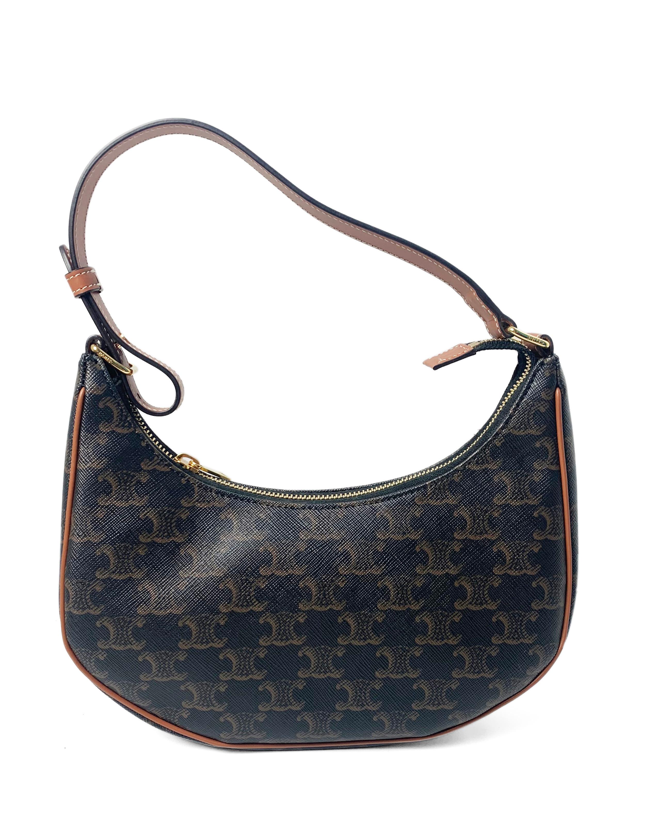 Celine 2020 Triomphe Canvas Printed Ava Crescent Shoulder Bag

Made In: Italy
Year of Production: 2020
Color: Tan
Hardware: Goldtone
Materials: Triomphe canvas with calfskin leather trim
Lining: Fine textile
Closure/Opening: Zip top
Exterior