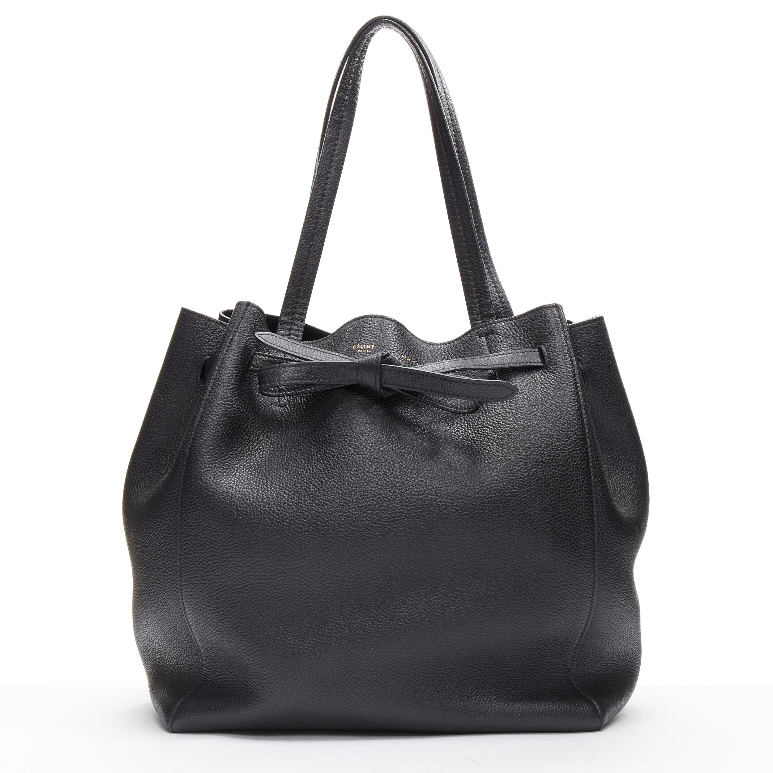 CELINE 2023 Cabas Phantom black leather top handle small tote bag
Reference: JYLM/A00034
Brand: Celine
Model: Cabas Phantom
Collection: 2023
Material: Leather
Color: Black
Pattern: Solid
Closure: Belt
Extra Details: Belt enables wearer to adjust bag