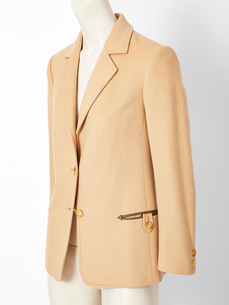 Celine, Paris,  camel hair blazer having a two button closures, and leather trim detail at the pockets.
C. 1970's.