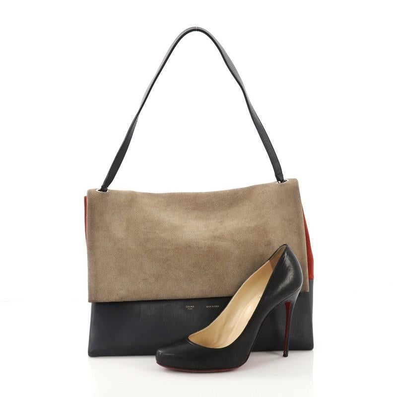 This Celine All Soft Tote Suede with Leather, crafted from beige and red suede with navy leather, features a flat leather shoulder strap, subtle stamped Celine logo, and silver-tone hardware. Its flap opens to a red leather interior. **Note: Shoe