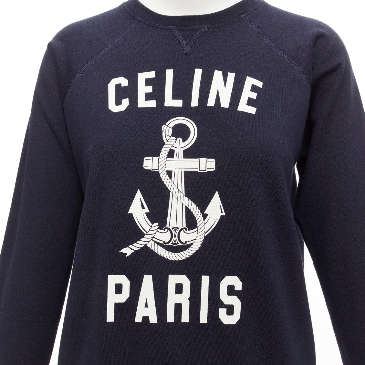 CELINE Anchor navy cotton cashmere logo print crew long sleeve sweatshirt XS
Reference: AAWC/A01098
Brand: Celine
Designer: Hedi Slimane
Material: Cotton, Cashmere
Color: Navy, White
Pattern: Logomania
Closure: Pullover
Made in: