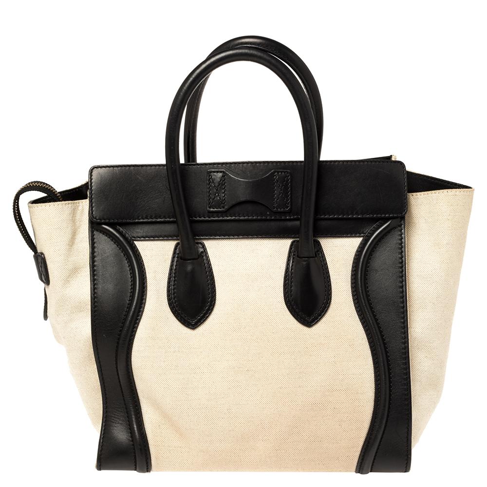 This Celine Luggage tote is stylish and perfect for everyday use. Crafted from canvas and leather, it features the signature flappy wings, double rolled handles, and a front zip pocket. The top zip closure opens to a perfectly sized interior that