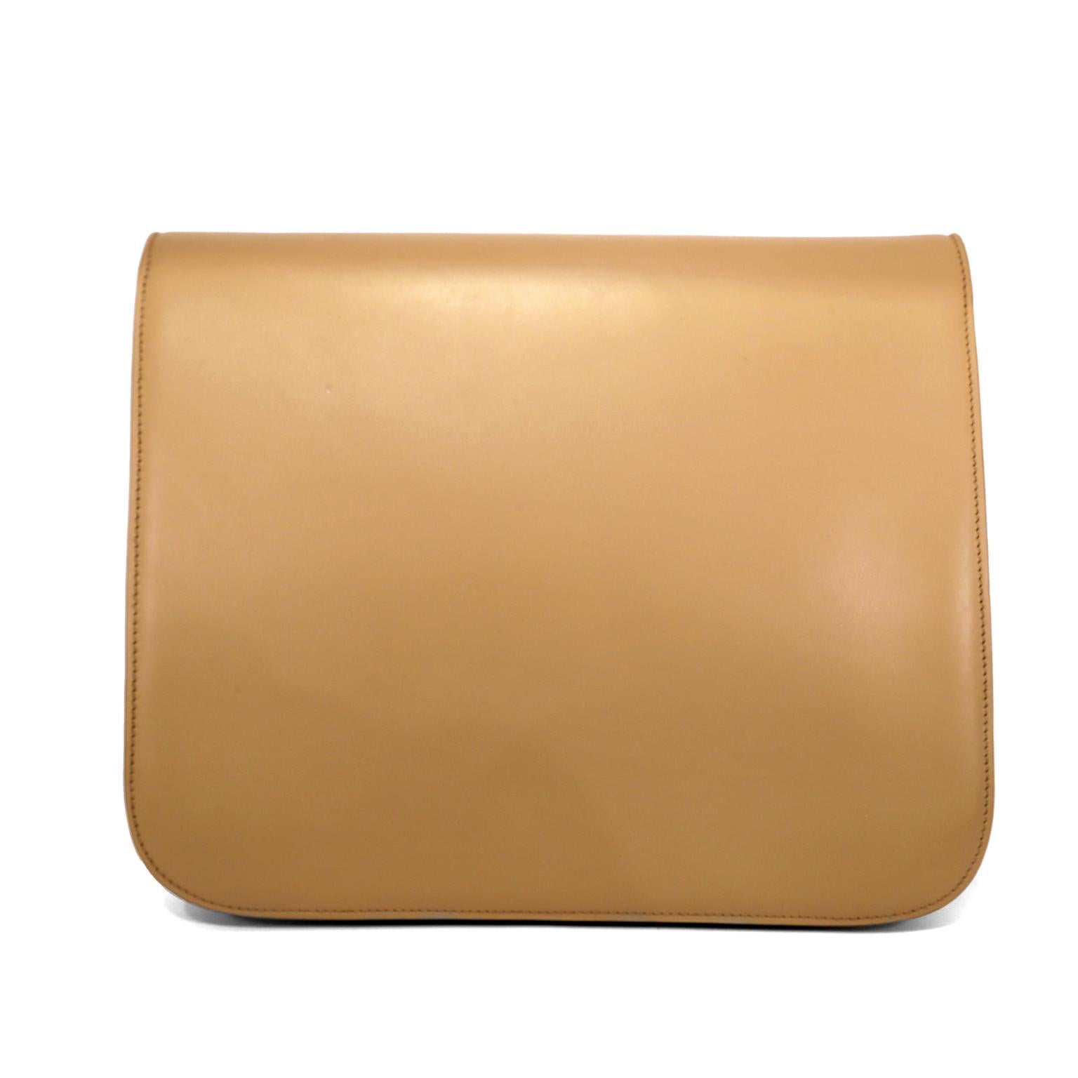 This authentic Celine Beige Calfskin Box Bag is in very good condition.  It has enjoyed a previous life and has minor imperfections that include a small scratch on the upper back.
Neutral beige smooth box calfskin with gold signature Celine hinged