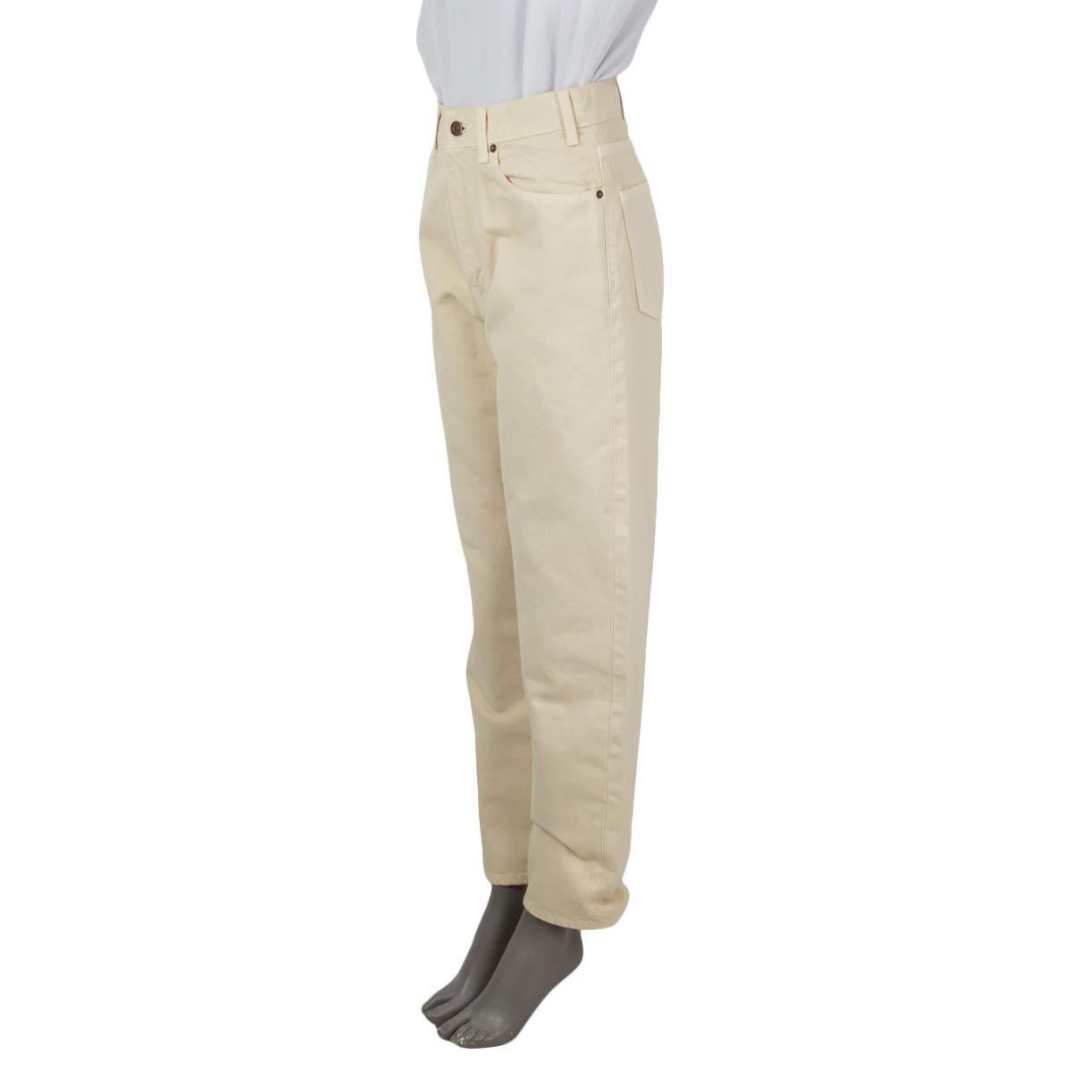 100% authentic Celine straight leg jeans in beige cotton (100%). Open with a zipper and one button in the front. Feature a high waist cut, belt loops, a coin pocket and two rounded slit pockets on the front and two slit pockets on the back. Have