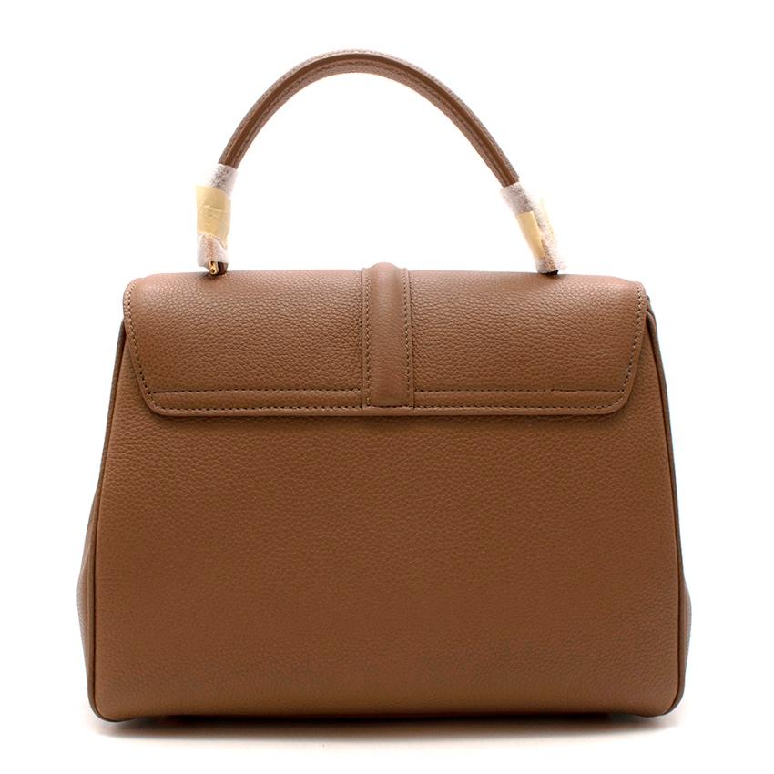 Celine Beige Grained Calfskin Small 16 Bag

The 16 was designed by Hedi Slimane on the first day of his arrival at Celine. A design that is based on the very parisian way of wearing a bag. The 16 recaptures the codes of some of the maison Celine's