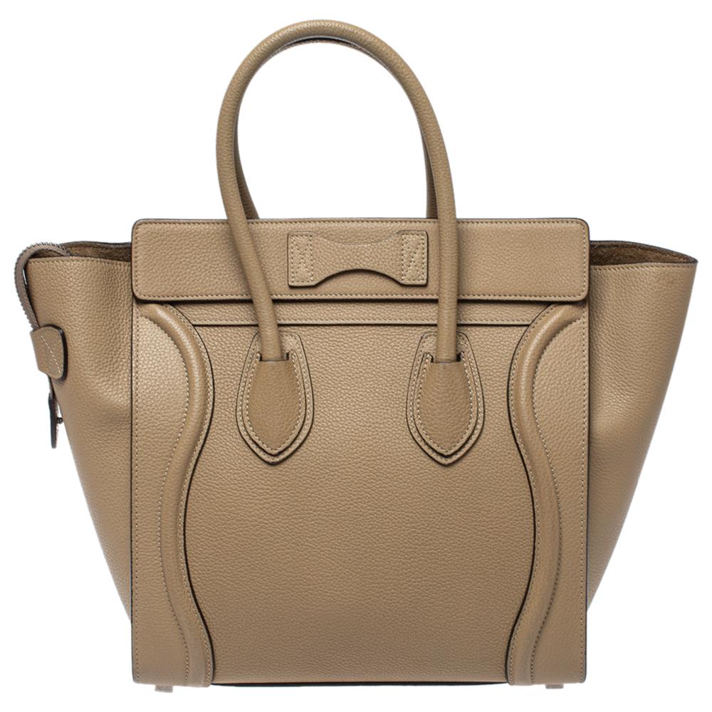 The mini Luggage tote from Celine is one of the most popular handbags in the world. This tote is crafted from leather and designed in a beige shade. It comes with rolled top handles and a front zip pocket. The bag is equipped with a well-sized