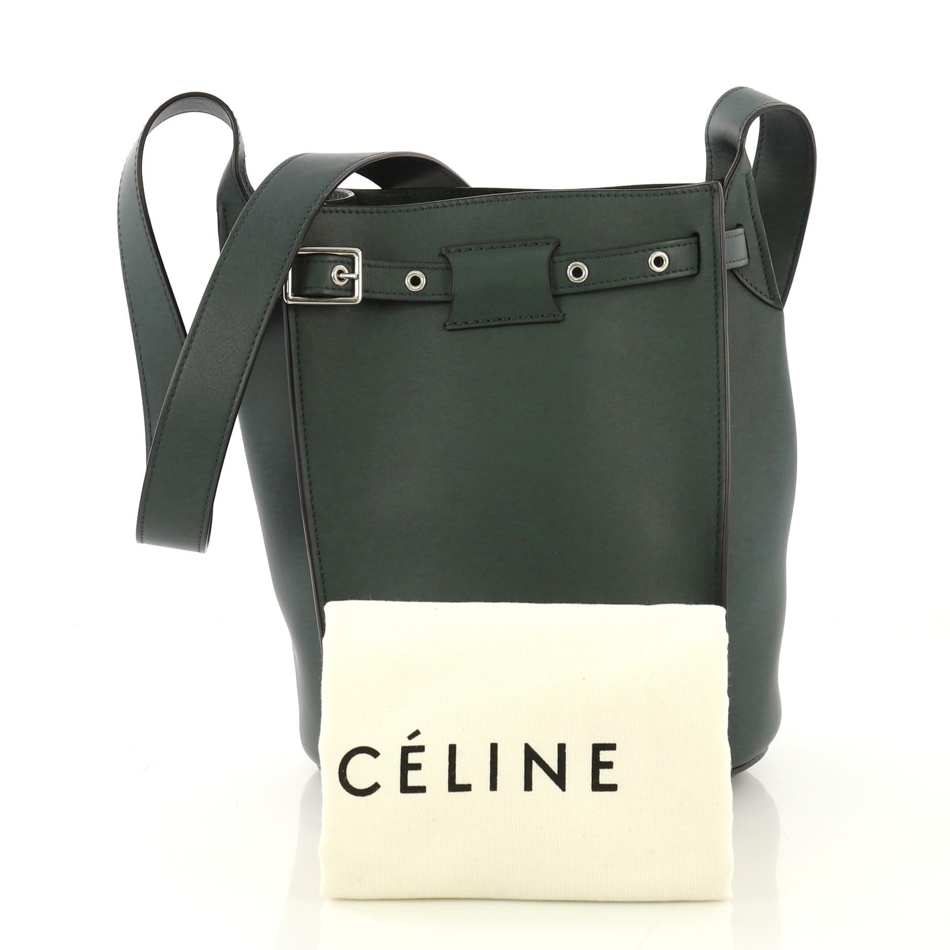 This Celine Big Bag Bucket Leather, crafted in green leather, features long leather strap and silver-tone hardware. Its belt drawstring closure opens to a green suede interior with side slip pocket.

Estimated Retail Price: $2,200
Condition: Great.