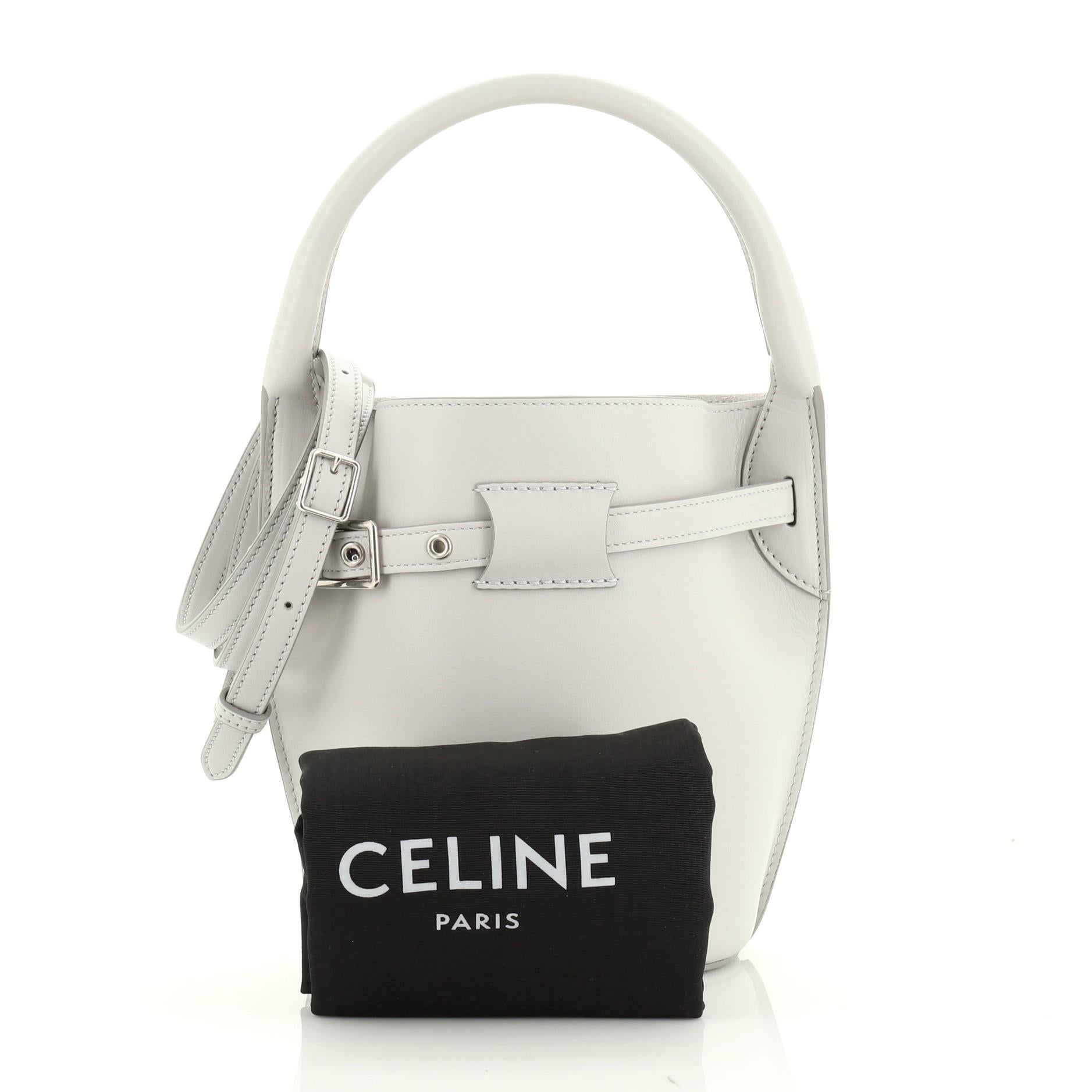 This Celine Big Bag Bucket Leather Nano, crafted in gray leather, features long leather strap, and silver-tone hardware. Its belt drawstring closure opens to a gray suede interior with side slip pocket. 

Estimated Retail Price: $1,950
Condition: