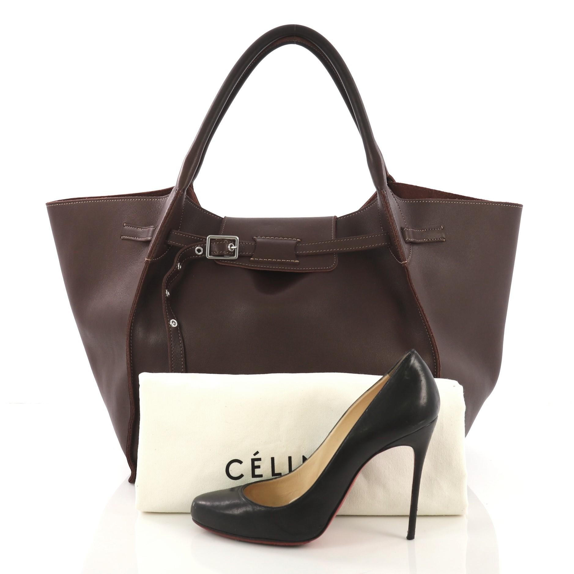 This Celine Big Bag Smooth Leather Medium, crafted from burgundy leather, features dual rolled handles, belt detail at the front and silver-tone hardware. It opens to a burgundy suede interior with zip pocket. **Note: Shoe photographed is used as a