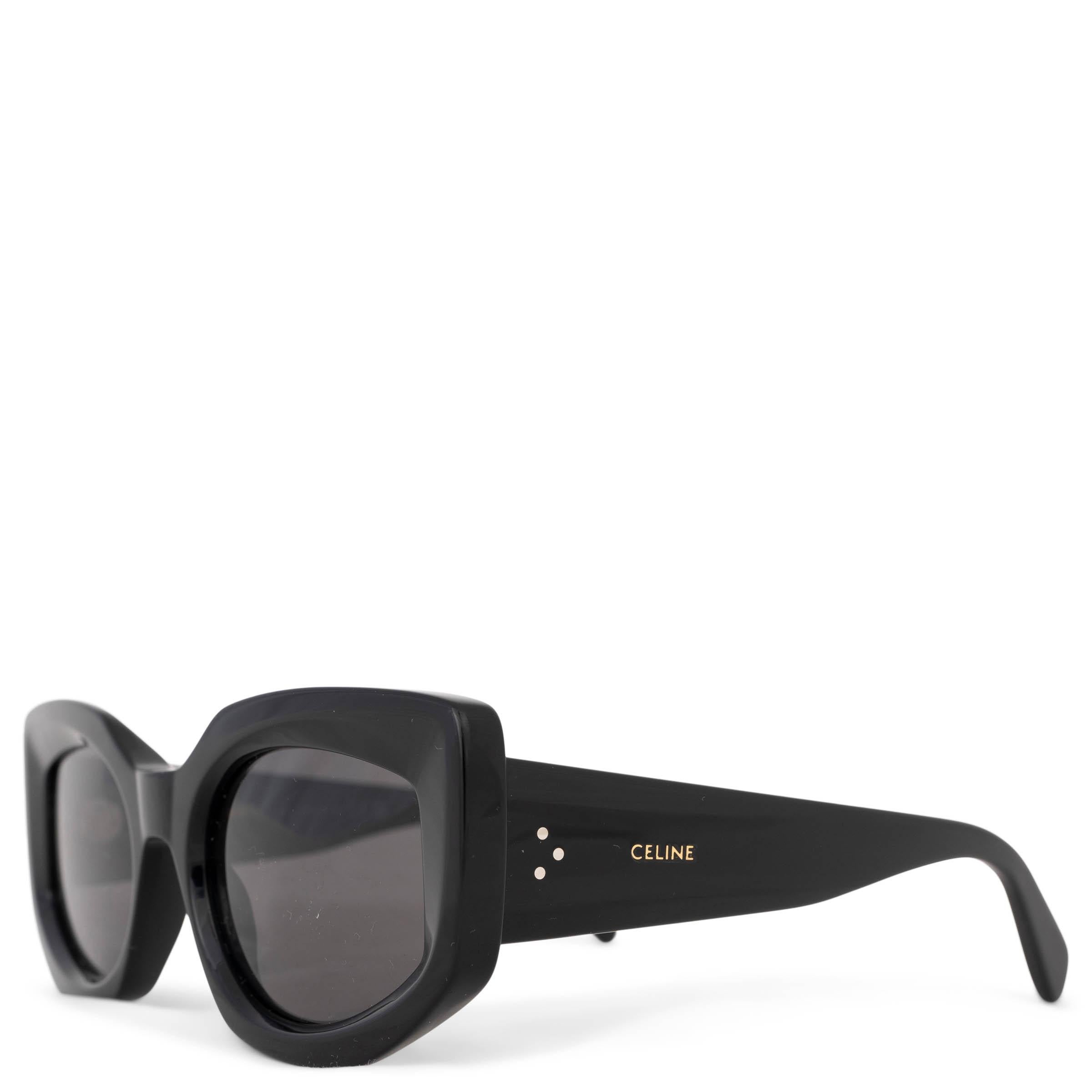 These 100% authentic Celine Bold 3 Dot sunglasses in black acetate offer a sleek, modern look with grey lenses. They feature a beveled frame and distinctive wide temples, finished with Céline’s signature three-dot detail on each side. A stylish and