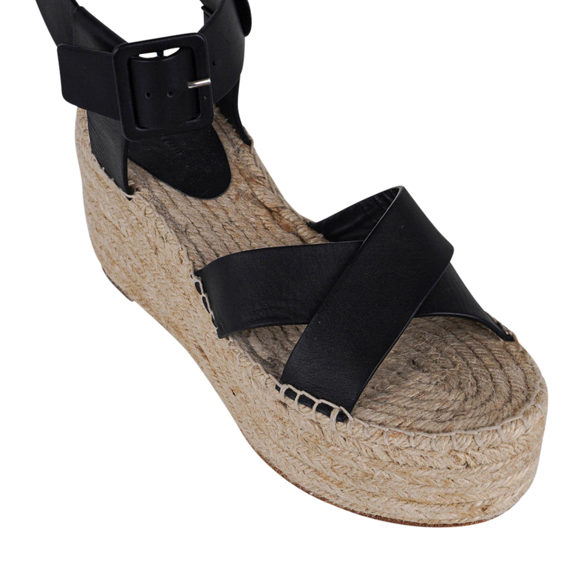 Guaranteed authentic Celine black 80 mm signature platform wedge espadrille.
Black ankle strap with buckle closure.
2