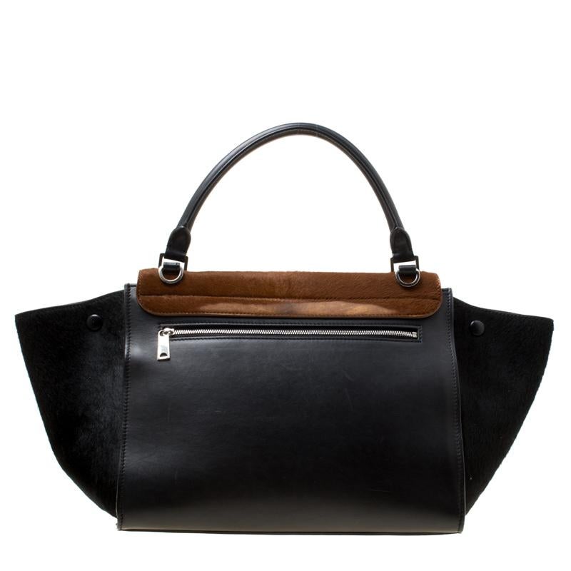 In every stride, swing, and twirl, your audience will gasp in admiration at the beautiful sight of this Celine bag. Crafted from Calf Hair and leather in Italy, the bag has a style that will catch glances from a mile. It has been designed with the