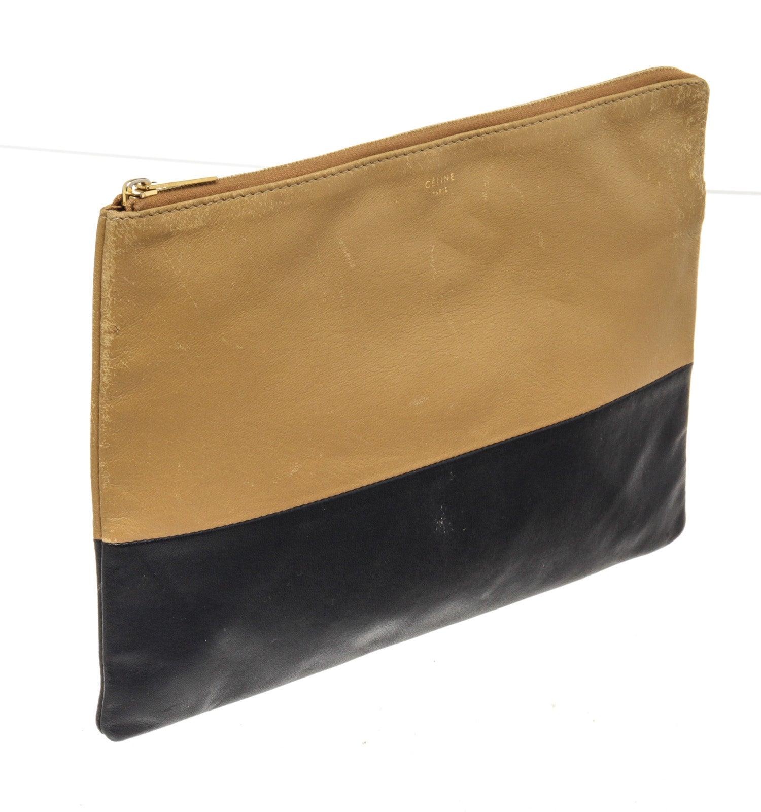 Celine Black Brown Leather Clutch Wallet with leather, gold-tone hardware trim leather and zipper closure.

49388MSC