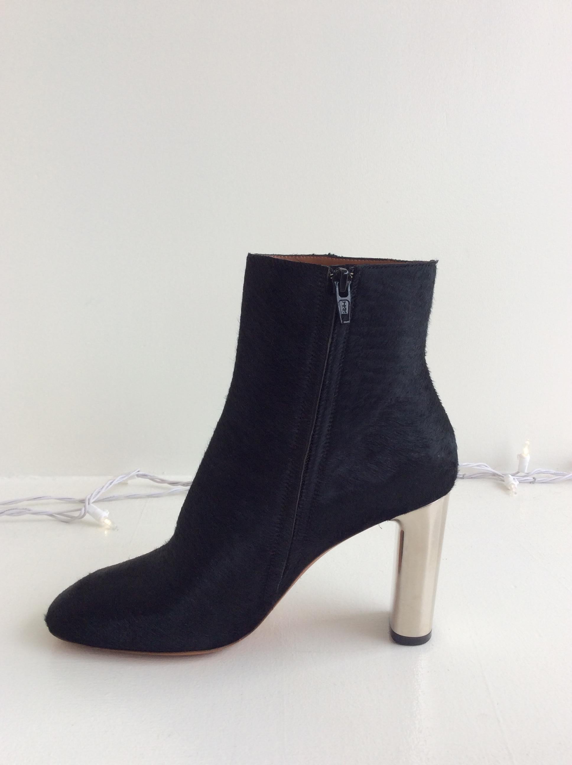 Celine black calf hair boot with silver metal heel, size 37.5. Side zipper. 3.5 inch heel. Brand new.