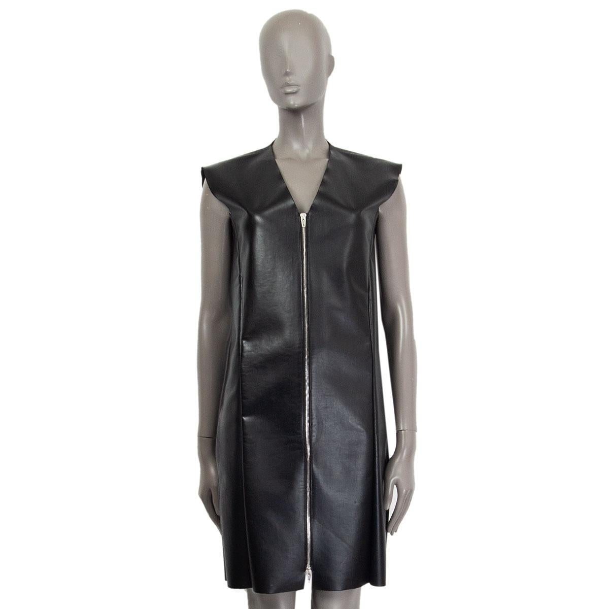 authentic Celine sleeveless faux leather shift dress in black polyurethane (100%) and inside in black polyamide (48%), polyester (34%) and elastane (18%). Closes with a zipper on the front and with slit pockets on the side. Has small scratches at