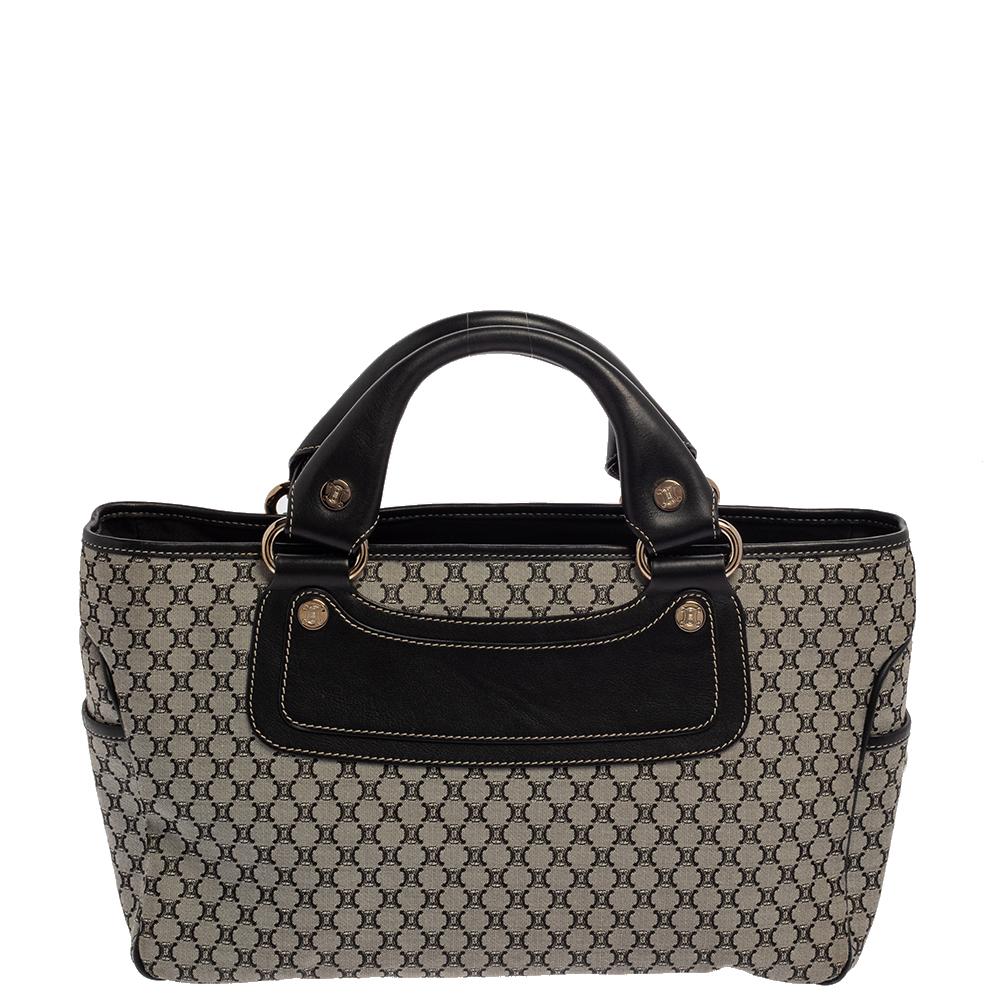 Ideal for everyday use, this Boogie tote is a Celine design. It is crafted from signature Macadam coated canvas and leather and equipped with spacious canvas interior housing pockets. The lovely tote is complete with two handles for you to flaunt.

