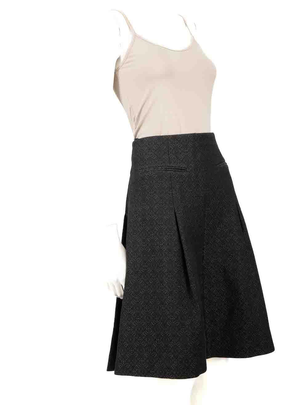 CONDITION is Very good. Minimal wear to skirt is evident where rear zipper seam is loosen on this used Céline designer resale item.
 
 
 
 Details
 
 
 Black
 
 Cotton
 
 Pleated skirt
 
 Jacquard quilted pattern accent
 
 2x Front side pockets
 
