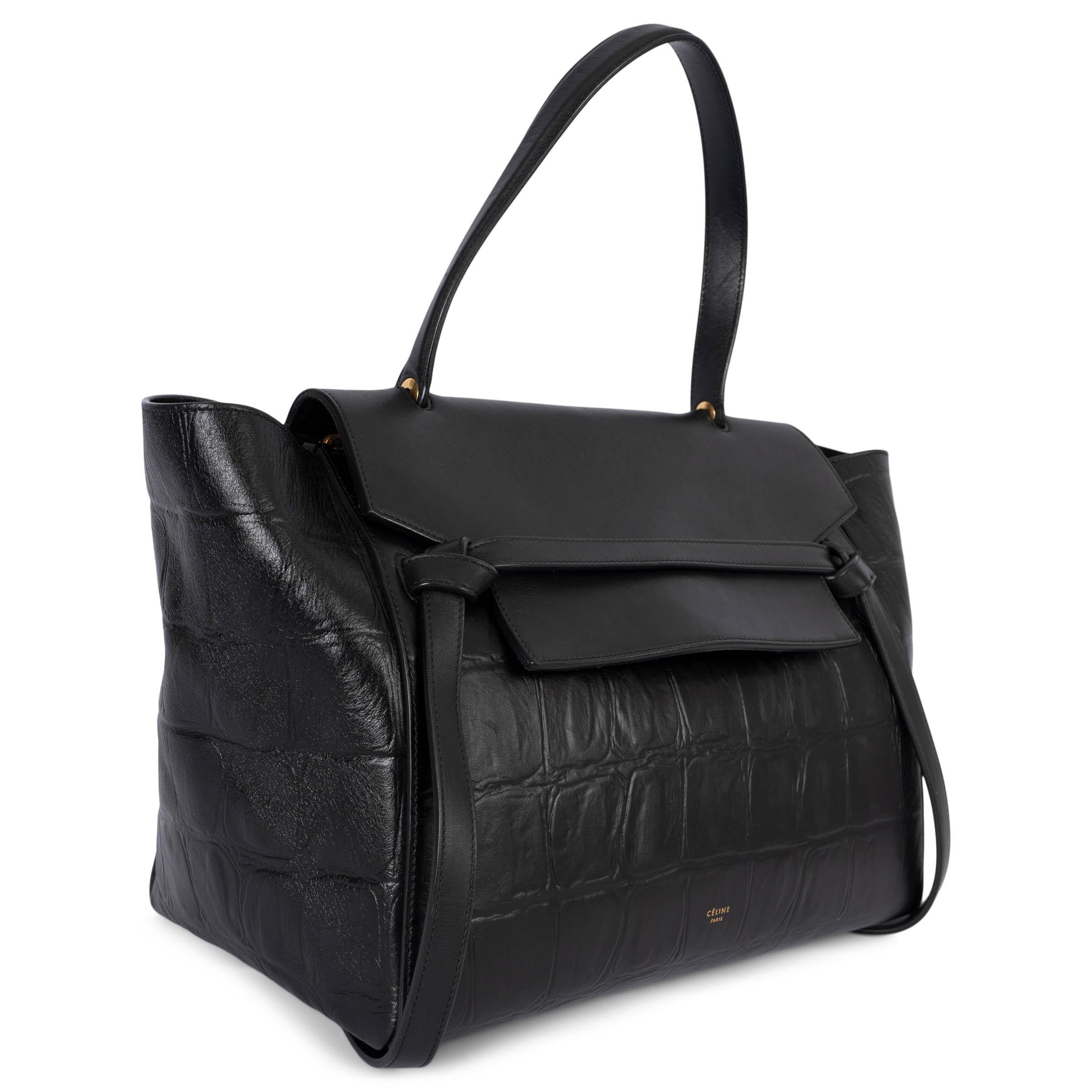 100% authentic Céline by Pheobe Philo Small Belt bag in black crocodile embossed leather with smooth calf leather flap. Features a zip pocket on the outside back. Closes with flap and zipper on top. Lined in suede with two open pockets against the