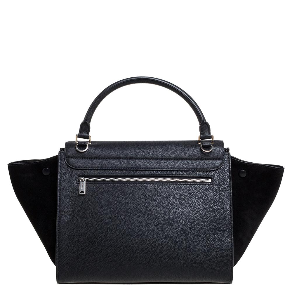 In every stride, swing, and twirl, your audience will gasp in admiration at the beautiful sight of this Celine bag. Crafted from leather and suede in Italy, the bag has a style that will catch glances from a mile. It has been designed with the