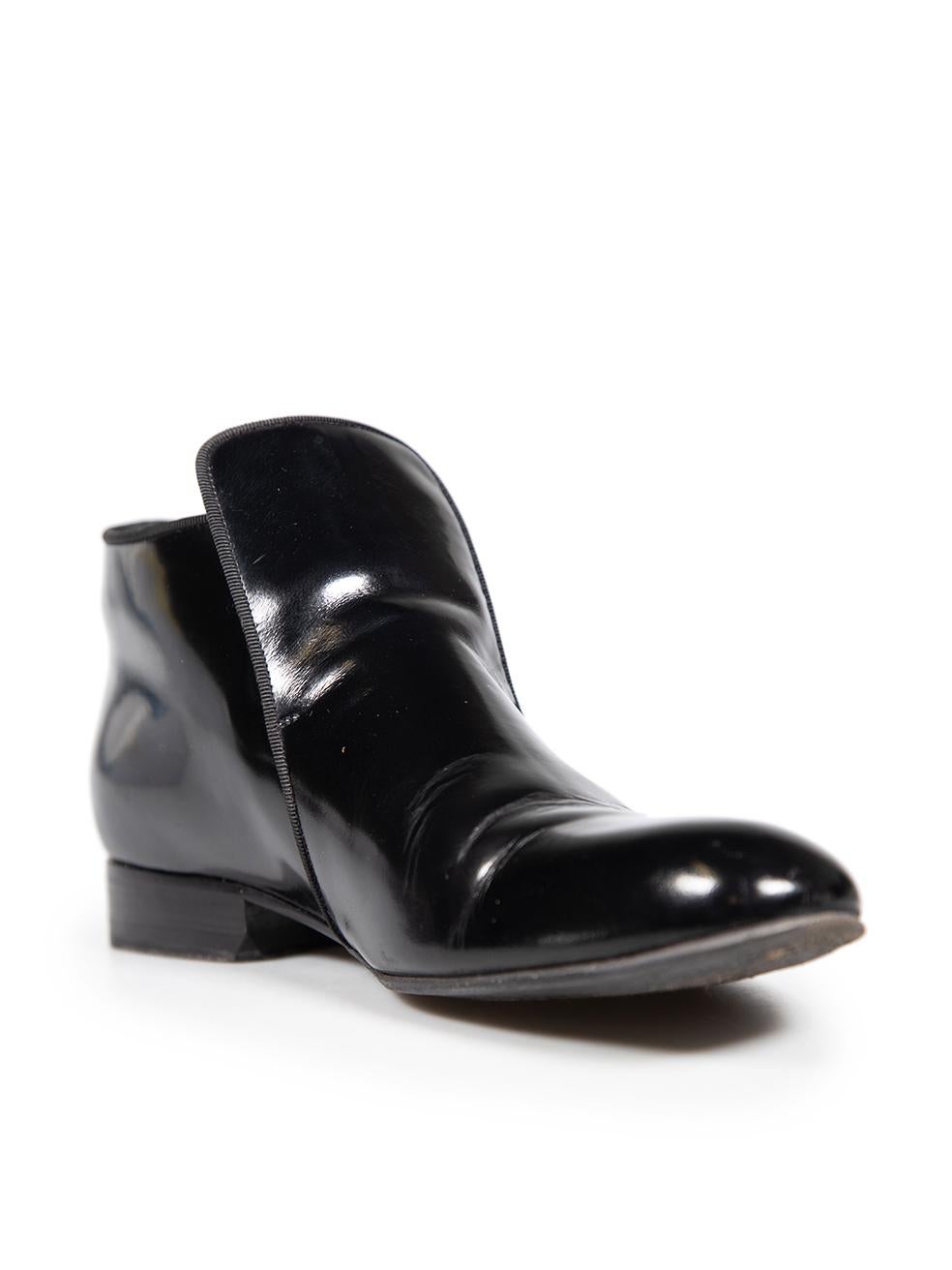 CONDITION is Very good. Minimal wear to the boots is evident. Abrasion to the toe box, vamp, counter and either side of both shoes. General creasing to the leather across the vamp, upper and above the counter on both shoes of this used Céline