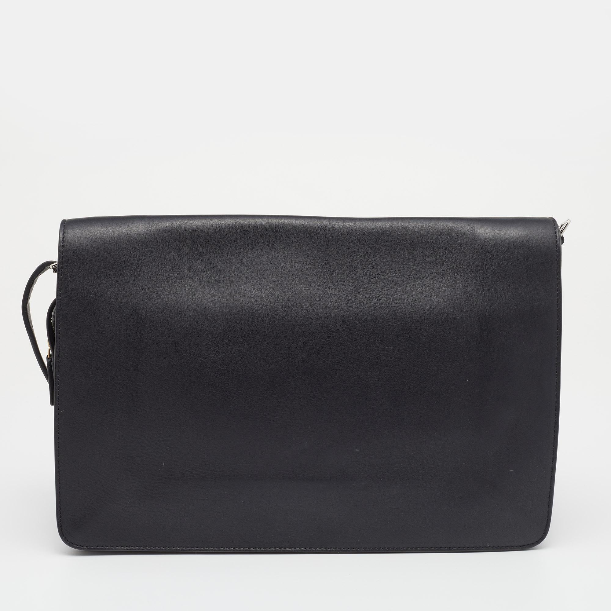 This stylish and effortless shoulder bag hails from the house of Celine. It has been crafted from quality leather and comes in a black shade. It has enough space for your essentials and is finished impeccably with gold-tone hardware.

Includes: