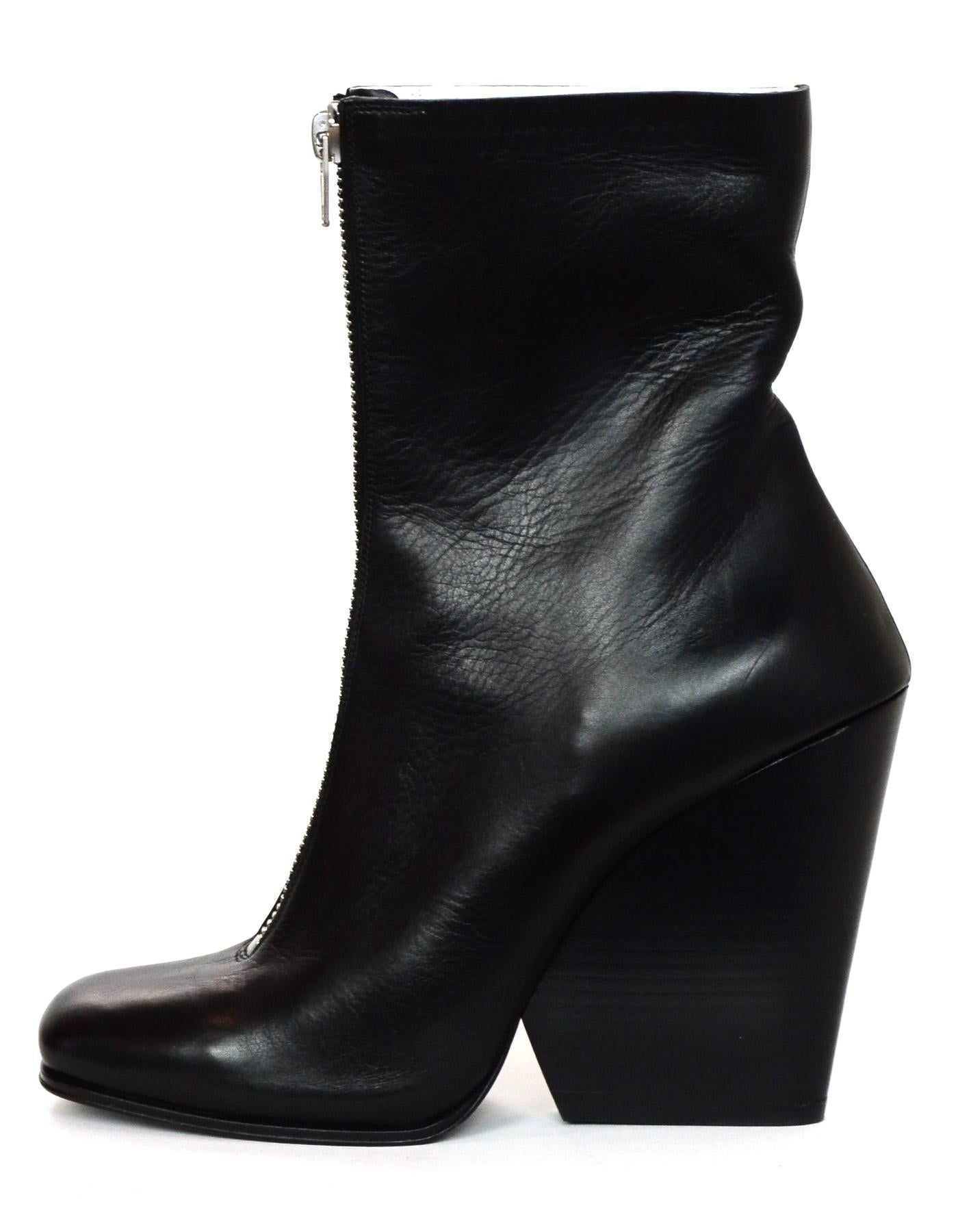 Celine Black Leather Front Zipper Wedge Boots Sz 40.5

Made In: Italy
Color: Black
Hardware: Silvertone
Materials: Leather
Closure/Opening: Front zipper opening
Overall Condition: Excellent pre-owned condition 
Estimated Retail: $1,200 +
