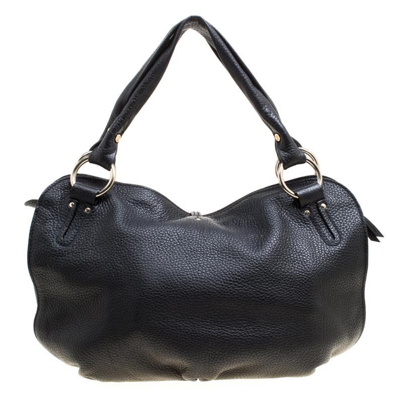 This chic and feminine hobo is from Celine. The bag is crafted from leather in a classy black shade. It features a thong detail, two handles and a top zip closure which opens to a fabric lined interior that can fit your daily essentials. Flaunt this