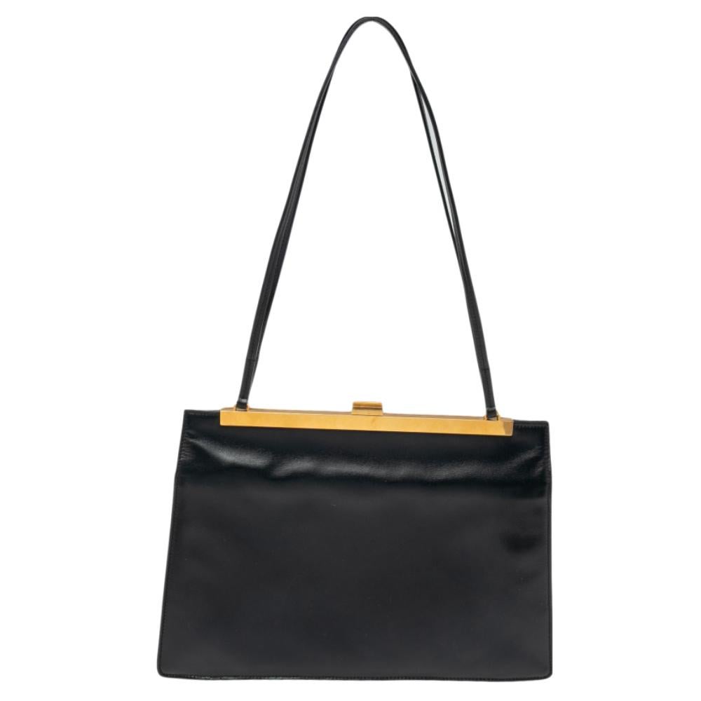Made for the modern woman, the Celine bag is made with the utmost skill. Crafted from leather in a versatile black shade, the structured silhouette is equipped with a well-sized interior and a top handle for you to parade it in style.

Includes: