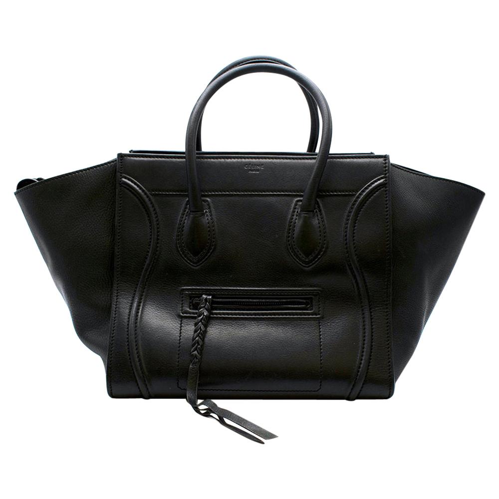 Celine Black Leather Medium Phantom Luggage Tote

- Classic Celine Phantom style tote
- Timeless design 
- Soft black calfskin leather 
- Lambskin lining 
- Inner leather clasp closure
- Small black outer zip pocket and one large inner pocket
- Twin