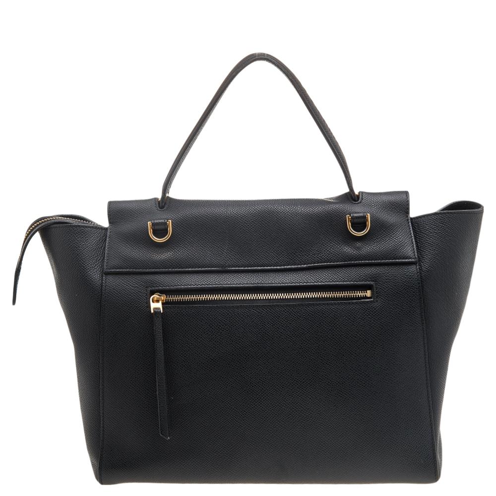 Bags from Celine are symbols of excellent craftsmanship and timeless design. This mini Belt bag from the House of Celine exudes never-ending charm and luxury! It is made from black leather and flaunts a spacious suede-lined interior and gold-tone